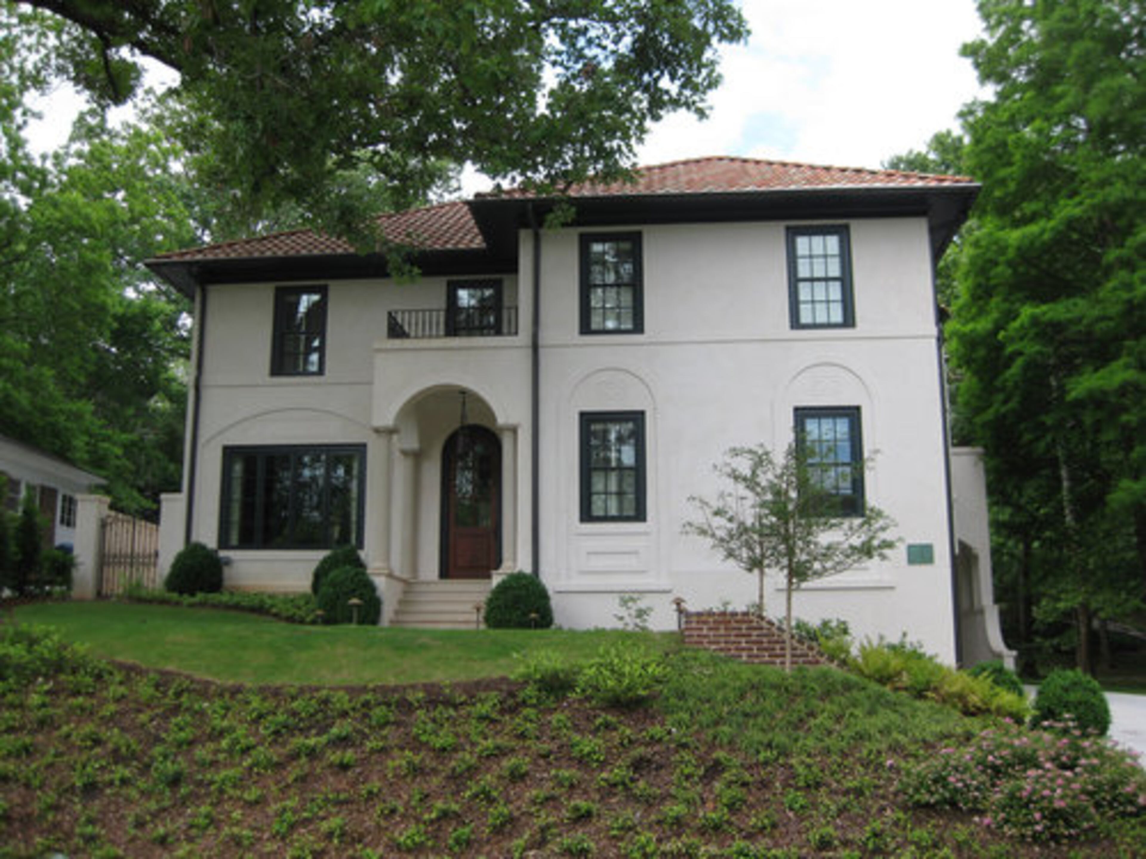 This Ansley Park home painted by the Paint Doctor Archie Deese uses neutral tones that blend with surrounding homes, but with idiosyncratic touches of green trim. You can play up unique architectural features of your Craftsman or Victorian with interesting trim color but, in general, color experts agreed that neutrals are the way to go. "I would probably stick with tans, beiges, taupes and grays," said Archie Deese.