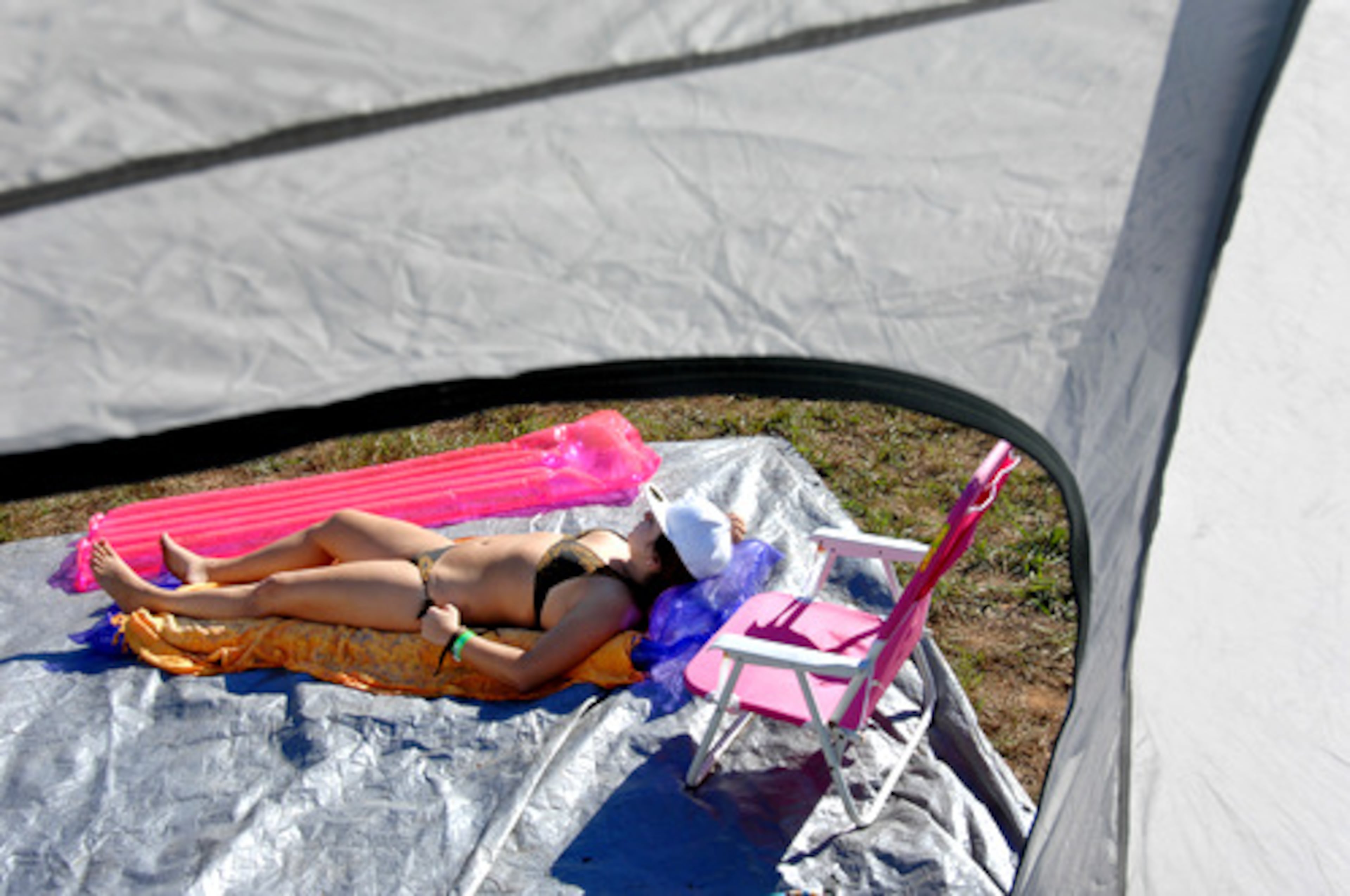 The early-morning chill didn't bother Tori Goldberg of Hilton Head, SC., who worked on her tan in the camping area.