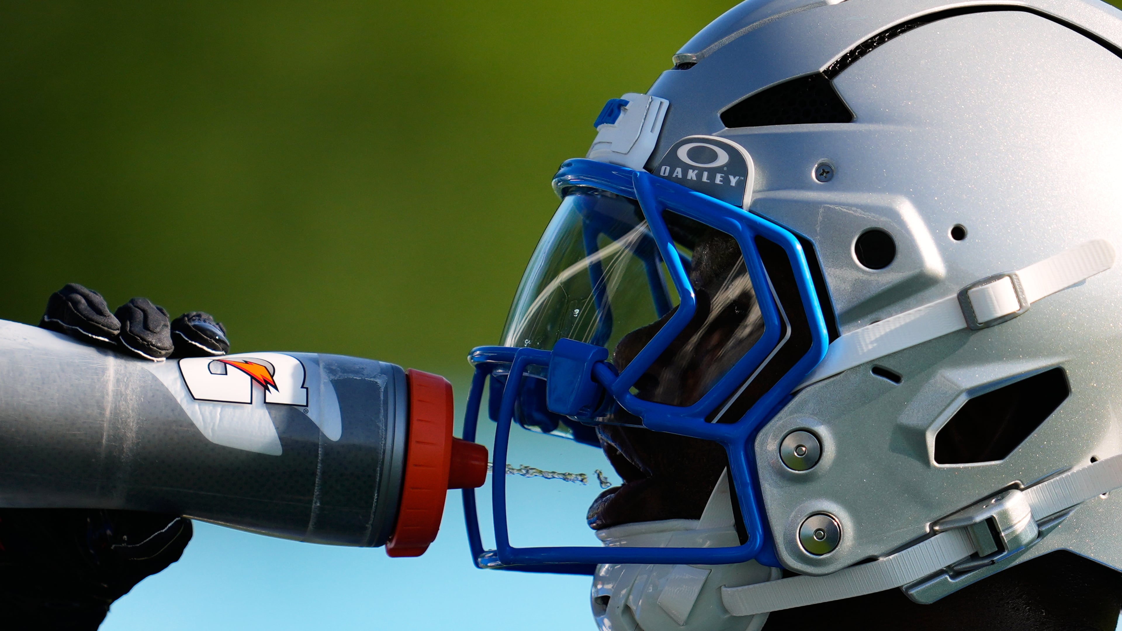 Detroit Lions running back Jabari Small drinks water to cool off from the heat during a NFL football training camp practice in Allen Park, Mich., Wednesday, July 29, 2026. (AP Photo/Paul Sancya)