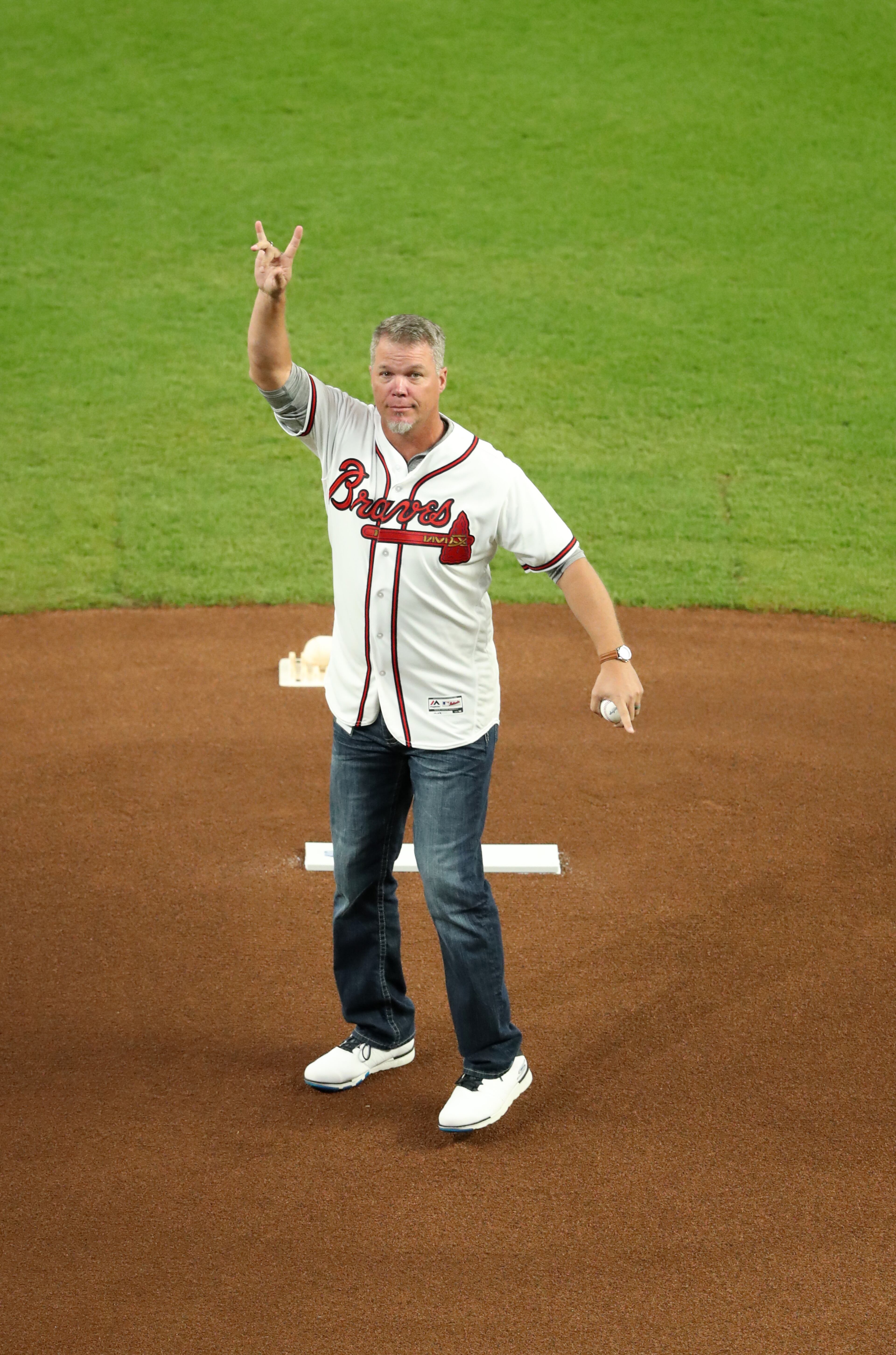 October 7, 2018 - Atlanta: Former Atlanta Braves third baseman Chipper Jones throws out the first pitch before the start of their game against the Los Angeles Dodgers in Game 3 of a National League Division Series baseball game Sunday, October 7, 2018, in Atlanta. (JASON GETZ/SPECIAL TO THE AJC)