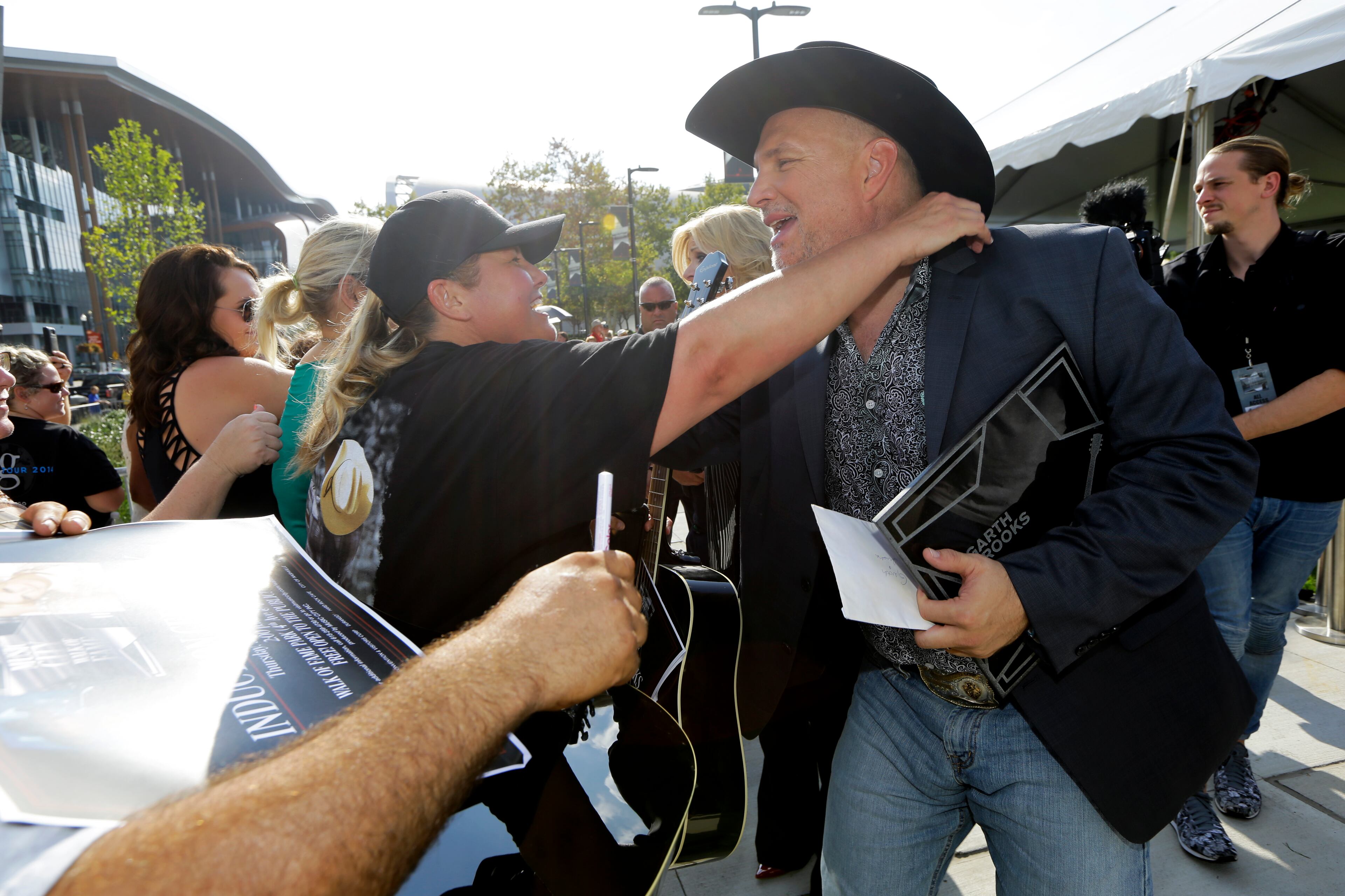Garth Brooks greets fans after receiving a star on the Music City Walk of Fame on Thursday, Sept. 10, 2015, in Nashville, Tenn. (AP Photo/Mark Humphrey)
