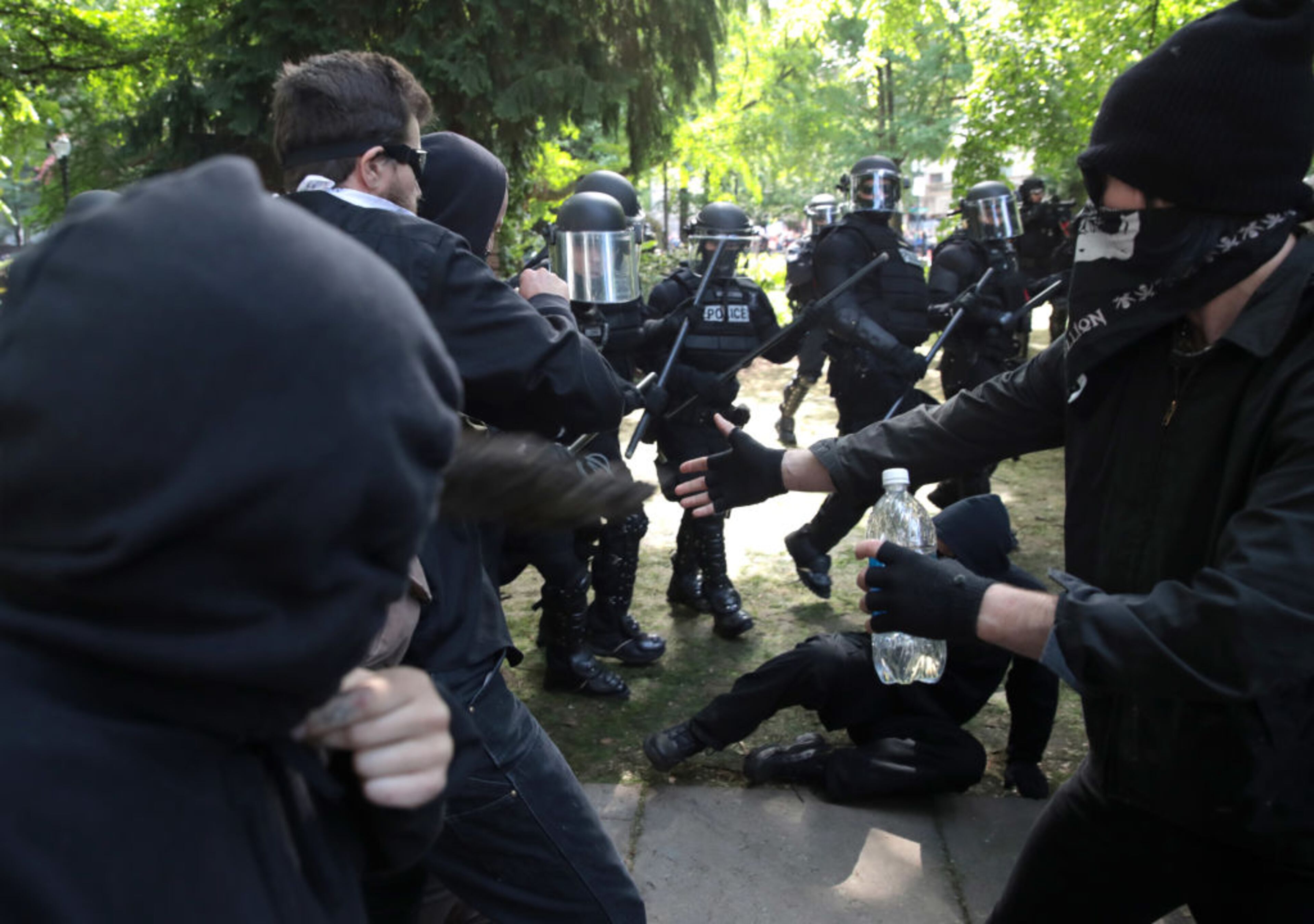 PORTLAND, OR - JUNE 04: Police clash with demonstrators as they try to clear 'Antifa' members and anti-Trump protesters from the area during a protest on June 4, 2017 in Portland, Oregon. Police used tear gas, flash bangs, and rubber bullets to clear the crowd. A protest dubbed "Trump Free Speech" by organizers was met by a large contingent of counter-demonstrators who viewed the protest as a promotion of racism. The demonstrations come in the wake of the recent violent attack on the city's MAX train line when Ricky Best, 53, and Taliesin Namkai-Meche, 23, were stabbed to death and Micah Fletcher,21, was severely injured after they tried to protect two teenage girls, one of whom was wearing a hijab, from being harassed with racial taunts by suspect Jeremy Christian. (Photo by Scott Olson/Getty Images)
