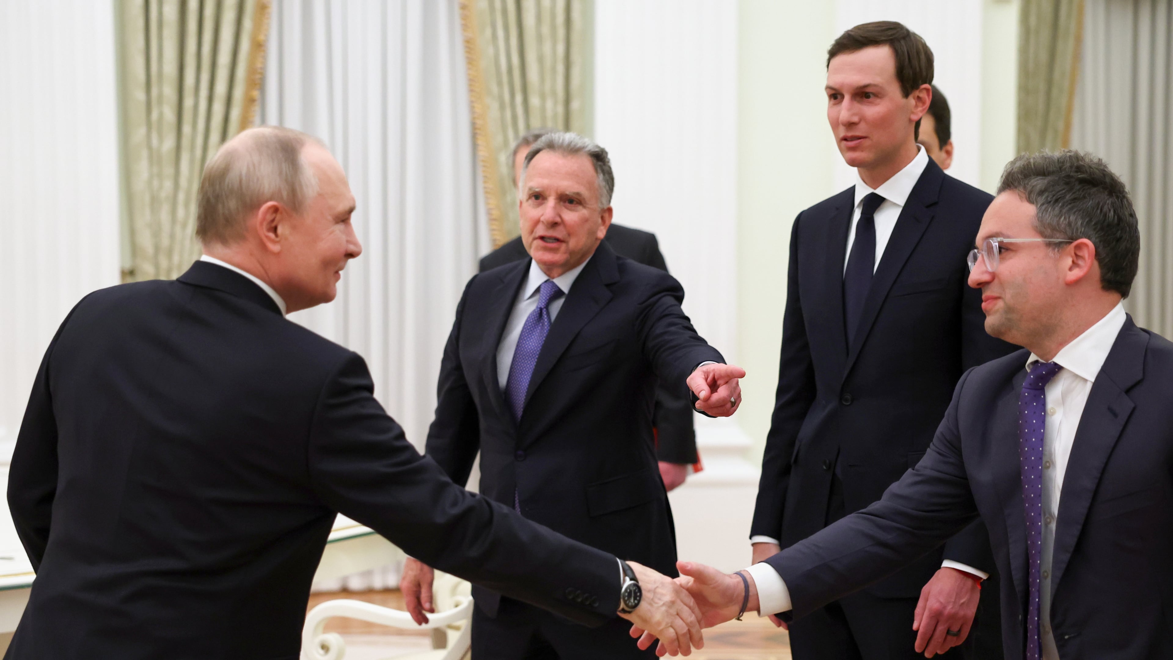 Russian President Vladimir Putin, left, greet U.S. President Donald Trump's envoys Steve Witkoff, centre left, Jared Kushner, second right, and Josh Gruenbaum, the head of the Federal Acquisition Service at the General Services Administration, at the Senate Palace of the Kremlin, in Moscow, Thursday, Jan. 22, 2026. (Alexander Kazakov/Sputnik, Kremlin Pool Photo via AP)