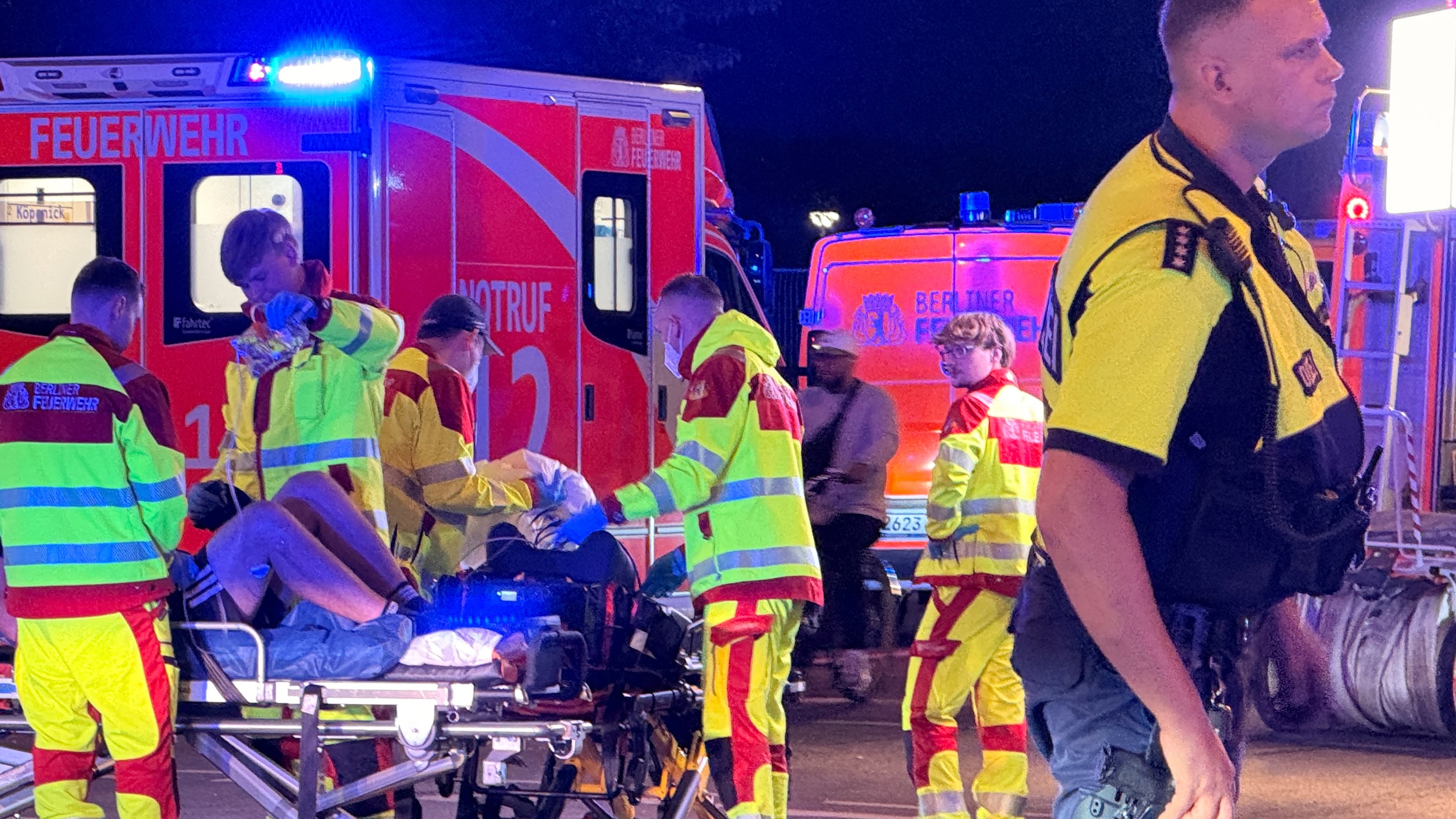 Emergency personnel tend to a person on a stretcher following the cancellation of Christopher Street Day in Berlin on Saturday, July 25, 2026. (Andreas Rabenstein/dpa via AP)