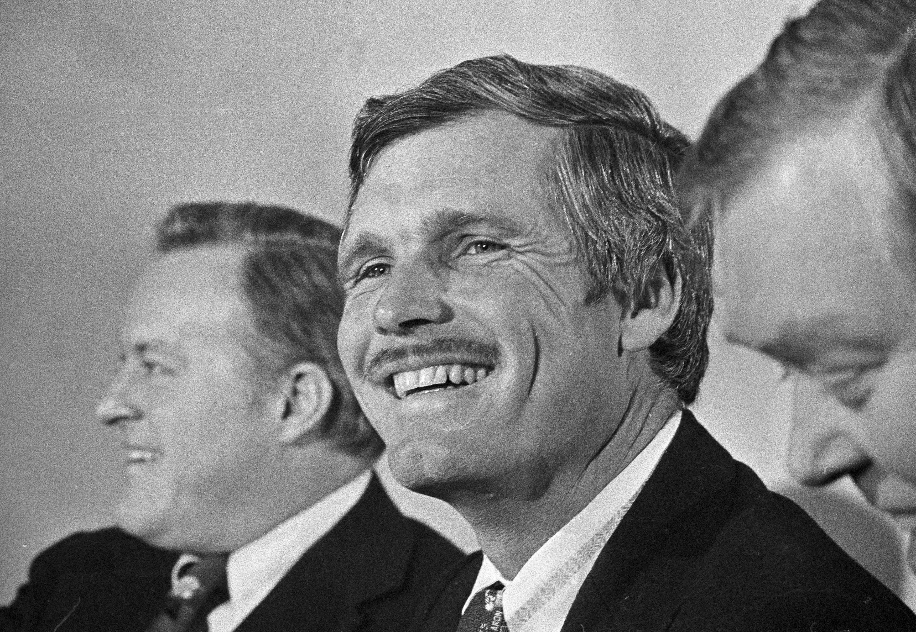Ted Turner, the media mogul, philanthropist, international sports impresario, rancher, and champion sailer, has had one of the best runs in human history. And he'll be the first to tell you so. These images tell the story of the outrageous life of Atlanta's own "Captain Outrageous." Here, Turner is all smiles at the announcement on Jan. 6, 1976, that he has puchased the Atlanta Braves. (Charles E. Kelly / AP file)