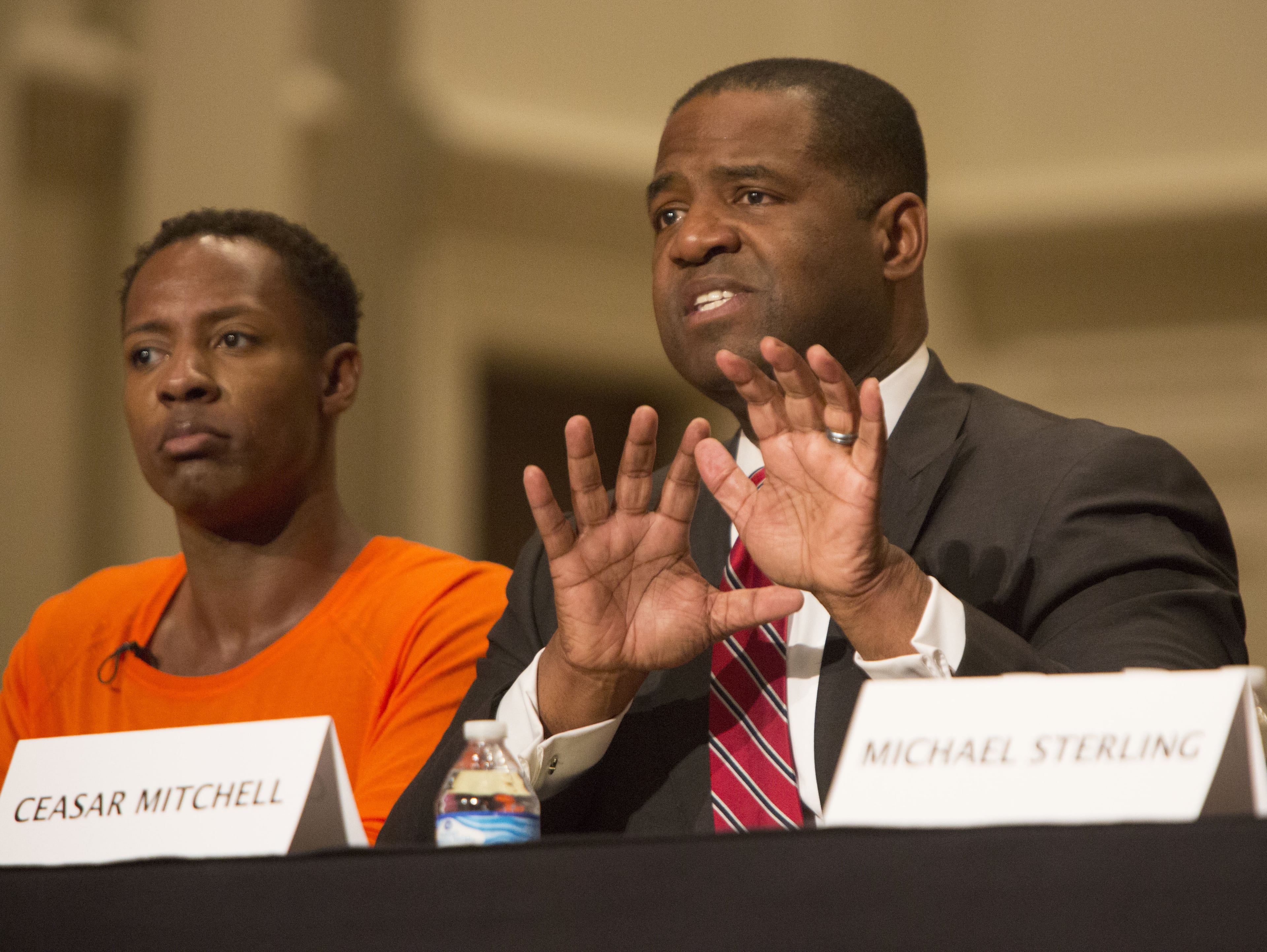 Ceasar Mitchell (right) makes a point during the Sept. 28 mayoral forum put on by WSB, the League of Women Voters and Emory University at Emory University's Glenn Memorial Auditorium. PHIL SKINNER / AJC