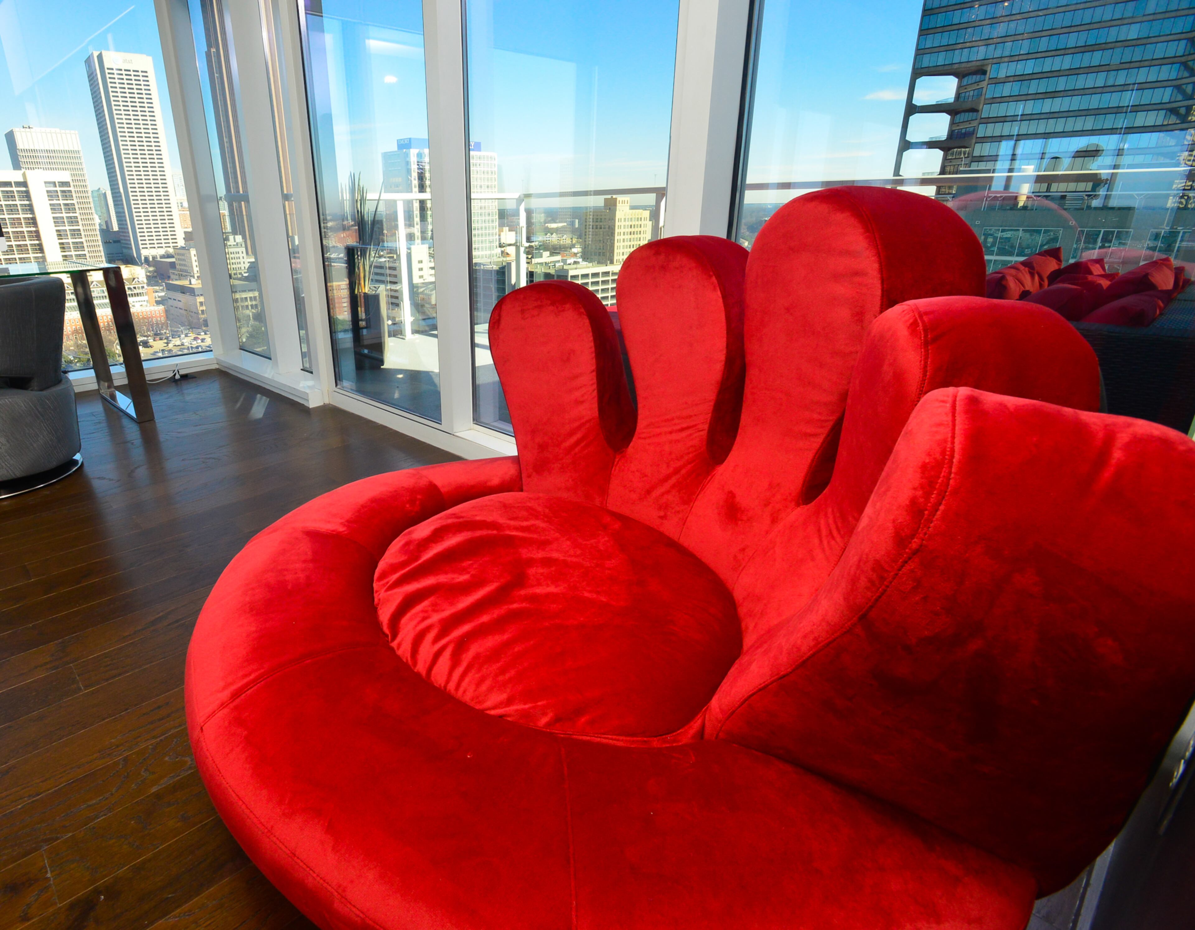 That's not a baseball glove, but a unique chair covered in red velvet. The chair originally was covered in white leather, but Jordan Schafer had it re-upholstered. He said it's a comfortable chair for him and his dog. -- Text by Lori Johnston