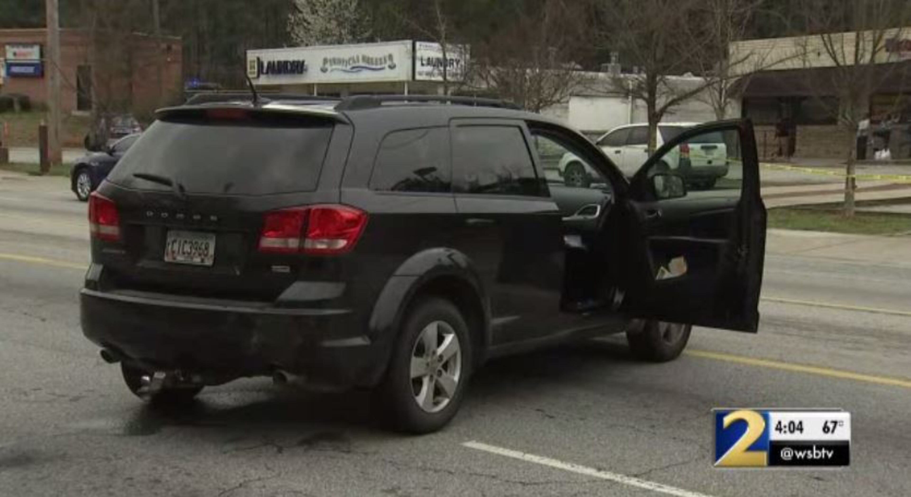 Police said a man and woman were arguing in this Dodge Journey before the man shot her.