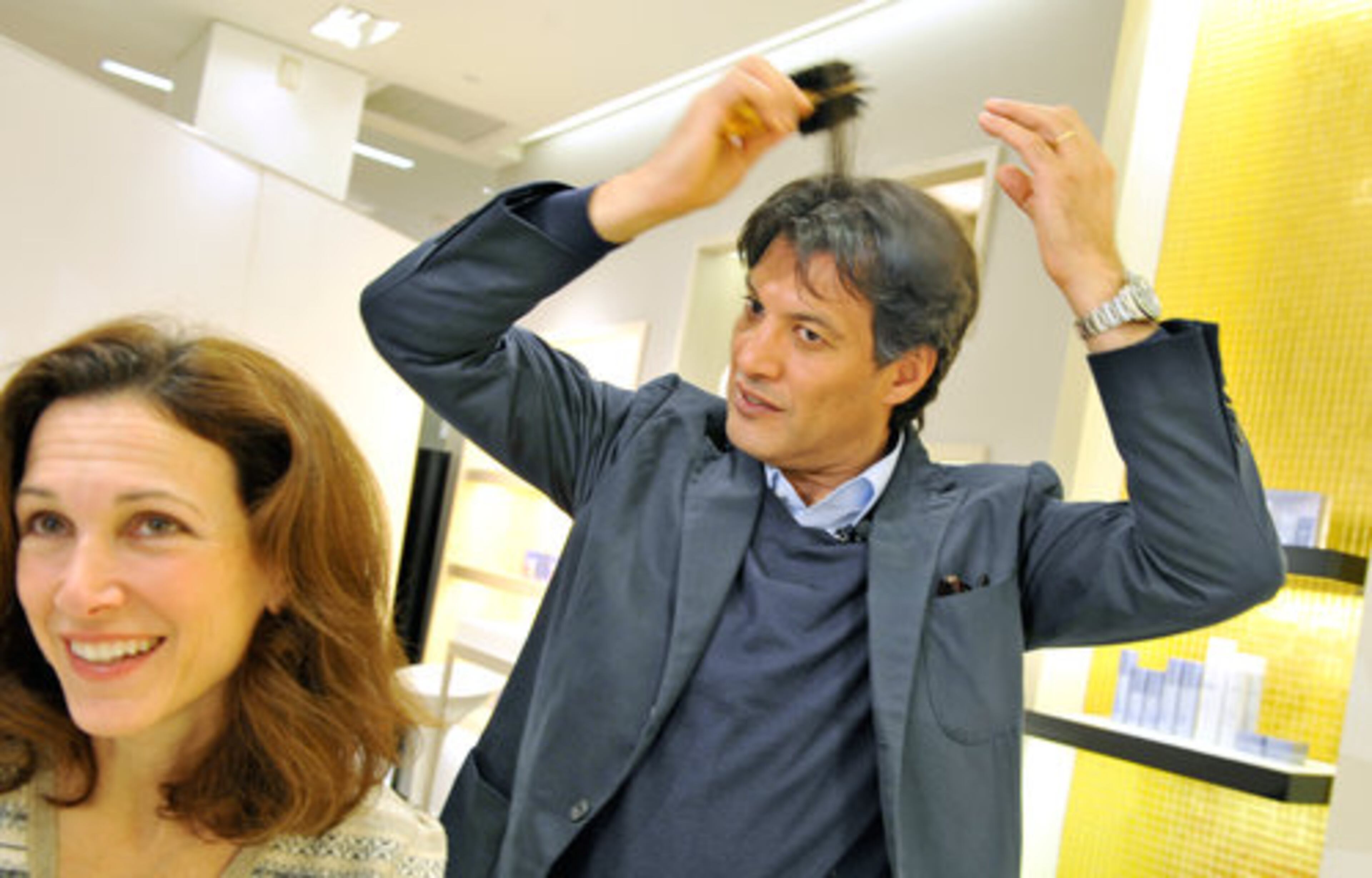 Celebrity hair stylist Frédéric Fekkai, famous for shaping coiffures of everyone from Heidi Klum to Bill Clinton, made a whirlwind tour of four Atlanta stores recently, to conduct consultations with a select few locals, sign a hairbrush or two and energize the retail troops in this lagging economy. Here, Fekkai draws a smile from Diane Silver as he gives her pointers on brushing her auburn locks at Saks Fifth Avenue in Phipps Plaza.