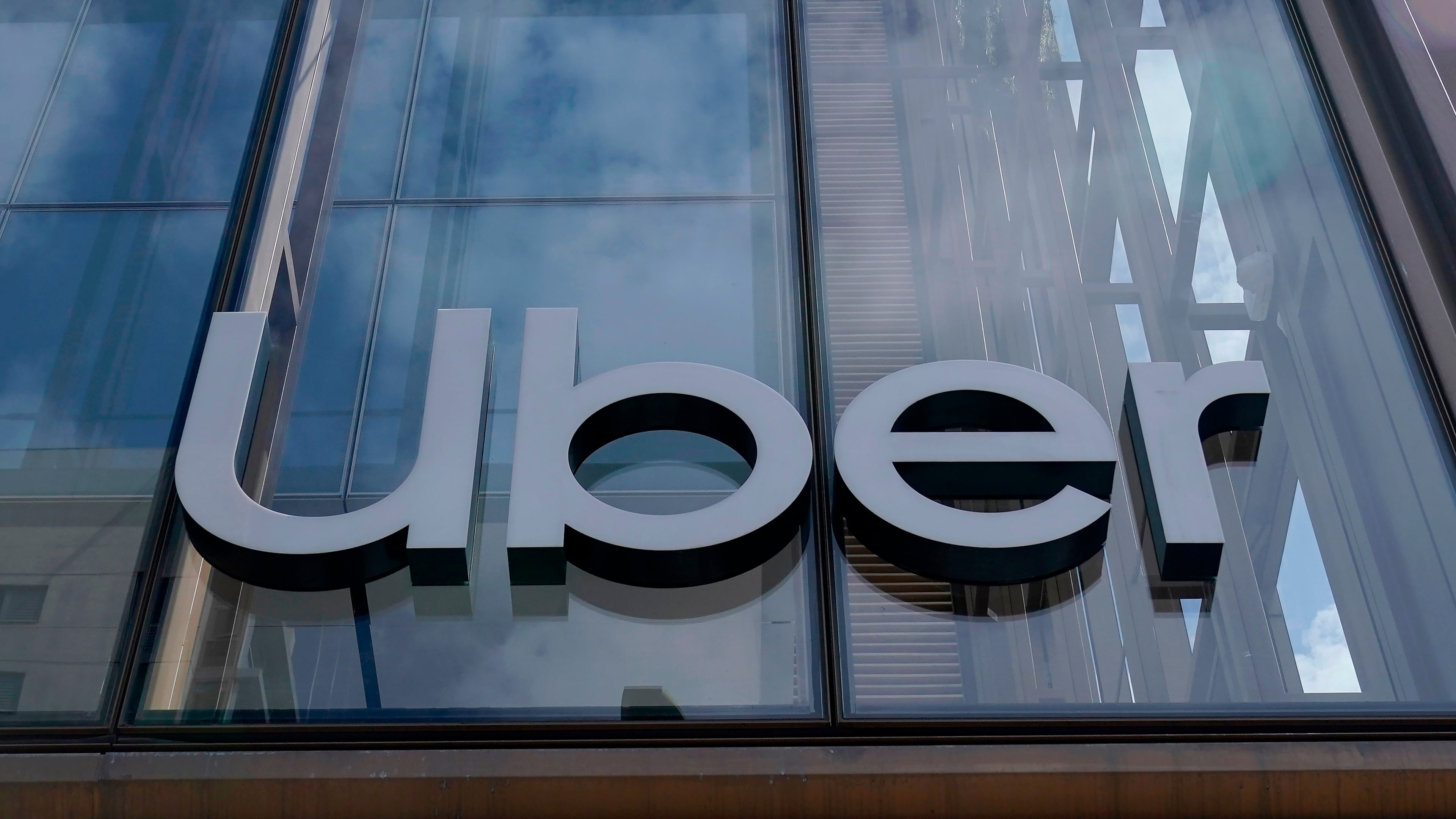 FILE - An Uber sign is displayed at the company's headquarters in San Francisco, Monday, Sept. 12, 2022. (AP Photo/Jeff Chiu, File)
