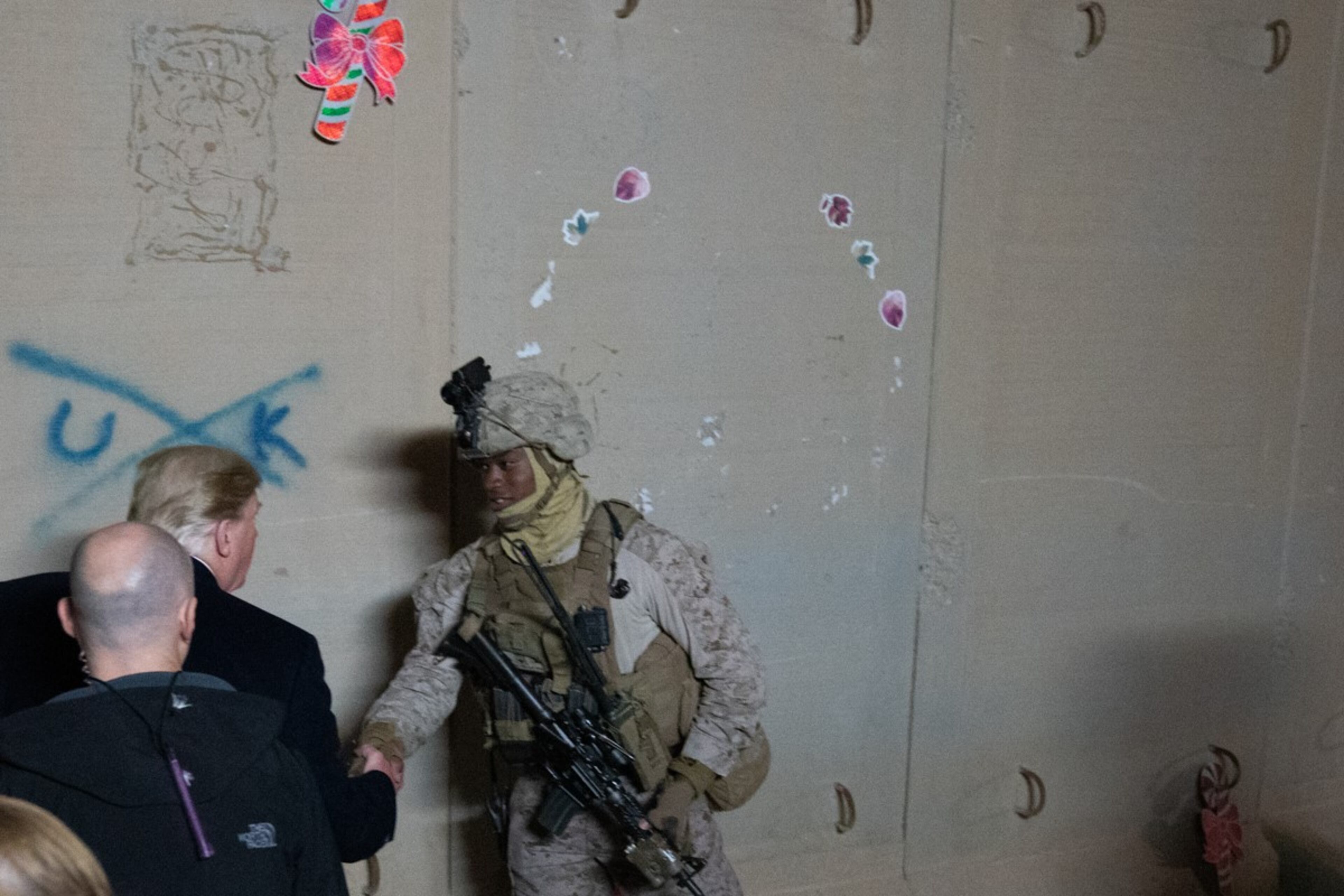 President Donald J. Trump stops to shake hands with a soldier on duty during his visit with U.S. troops Wednesday, December 26, 2018, at the Al-Asad Airbase in Iraq.