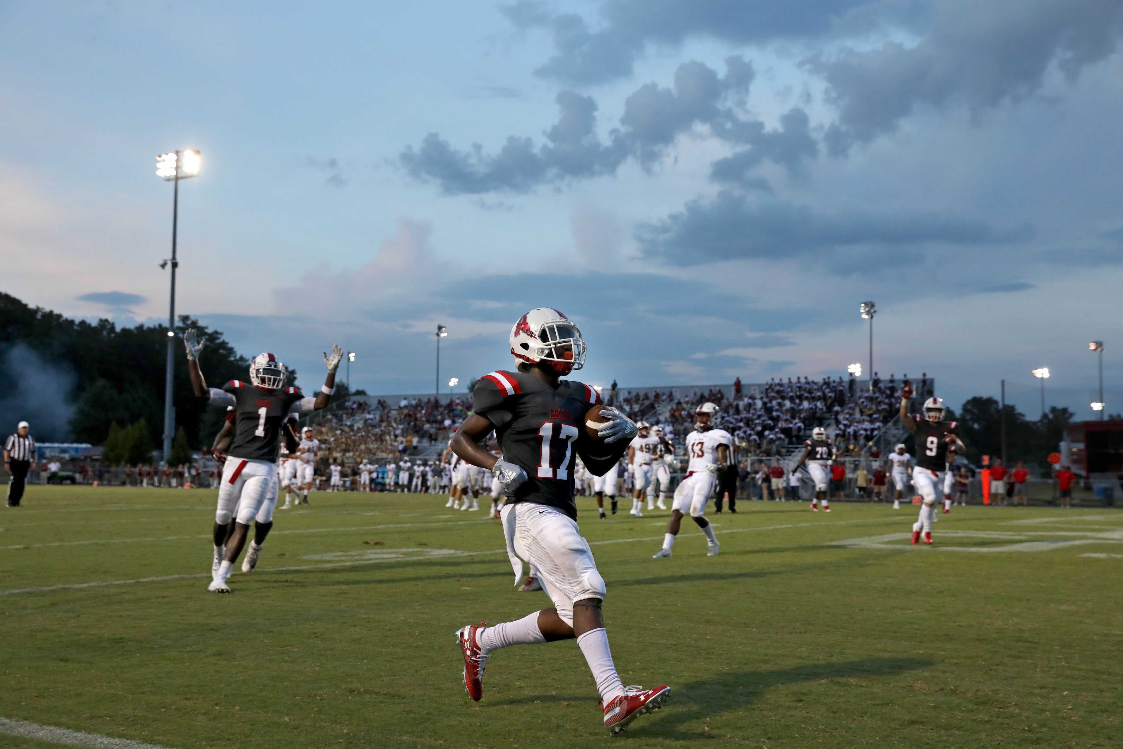 Archer running back Jeremiah Cook (17) scores a touchdown in the first quarter against Mill Creek at Archer High School Friday, September 7, 2018, in Lawrenceville, Ga. (JASON GETZ/SPECIAL TO THE AJC)