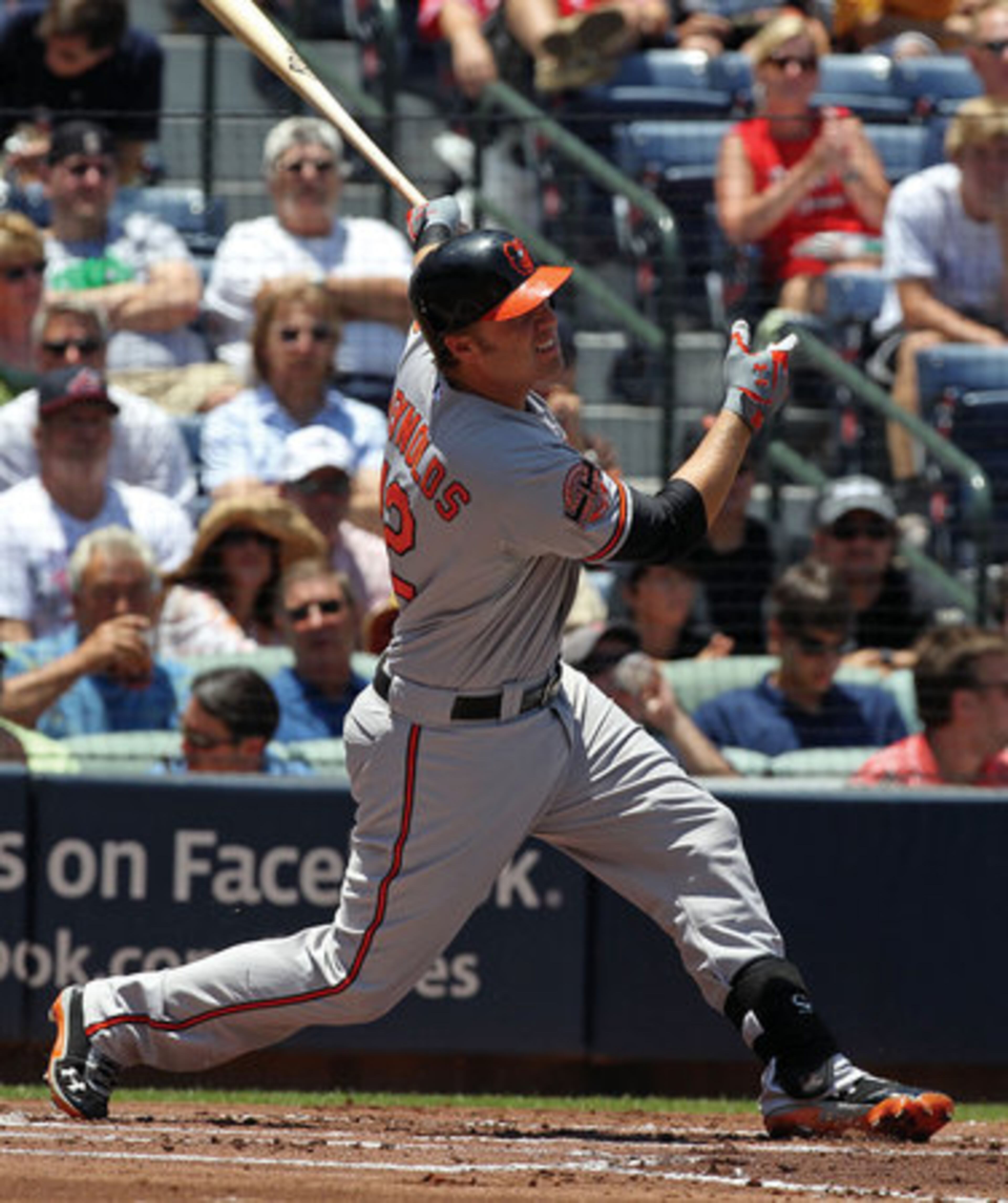 Orioles Mark Reynolds hits a sacrifice fly to score Adam Jones for a 1-0 lead over the Braves.