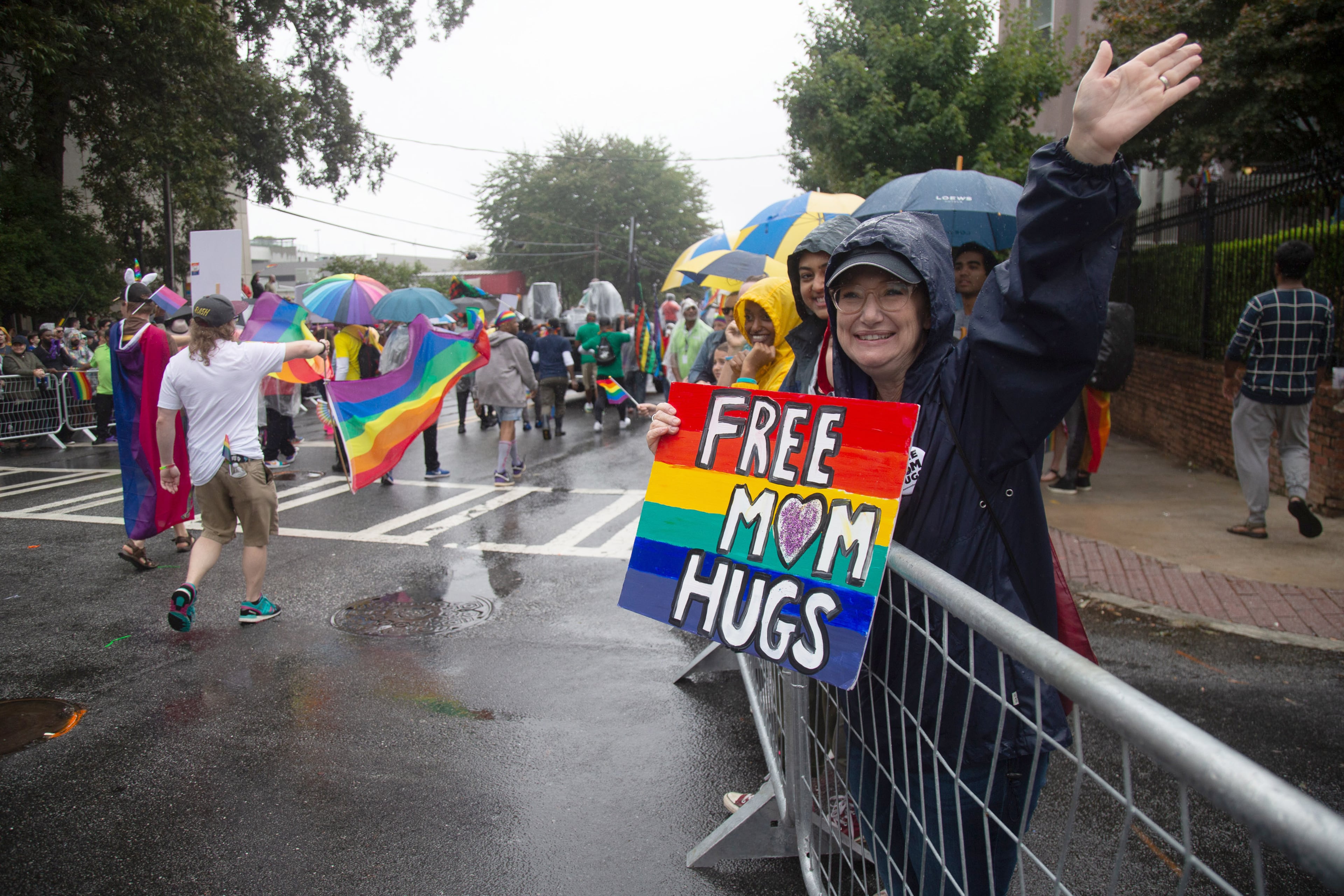 Michele Scott gives out free mom hugs during the 49th annual Pride Festival and Parade in Atlanta on Sunday, Oct. 13, 2019. STEVE SCHAEFER / SPECIAL TO THE AJC