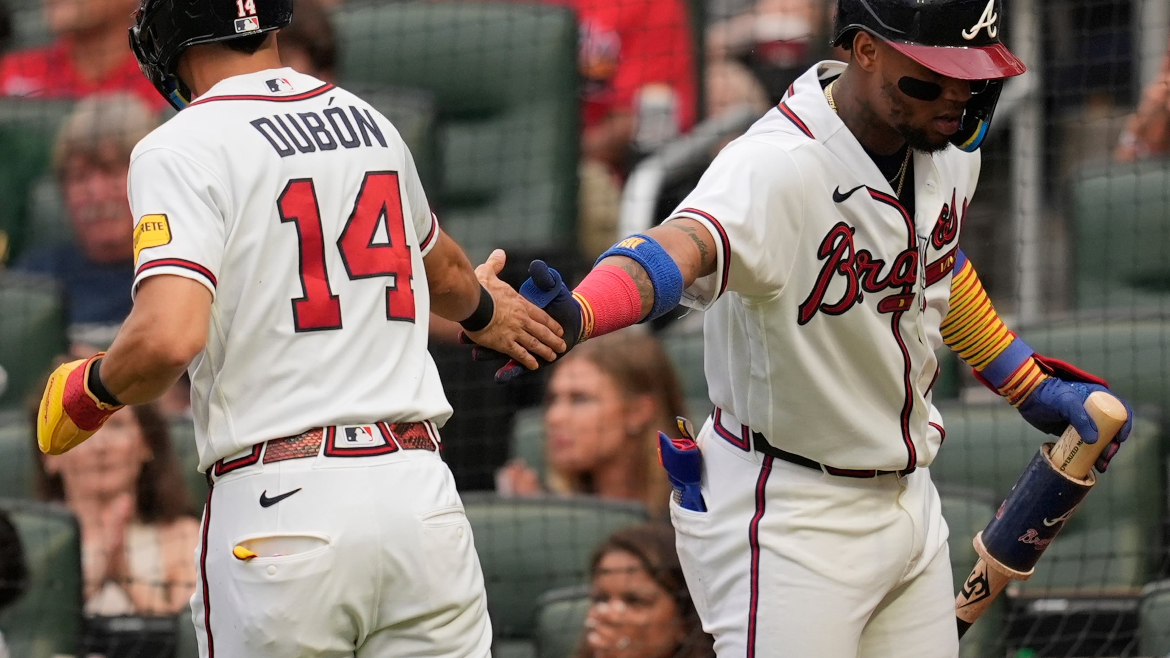 Atlanta Braves' Mauricio Dubón (14) celebrates scoring off the bat of Drake Baldwin in the second inning of a baseball game against the Miami Marlins, Wednesday, Aug. 5, 2026, in Atlanta. (Mike Stewart/AP)
