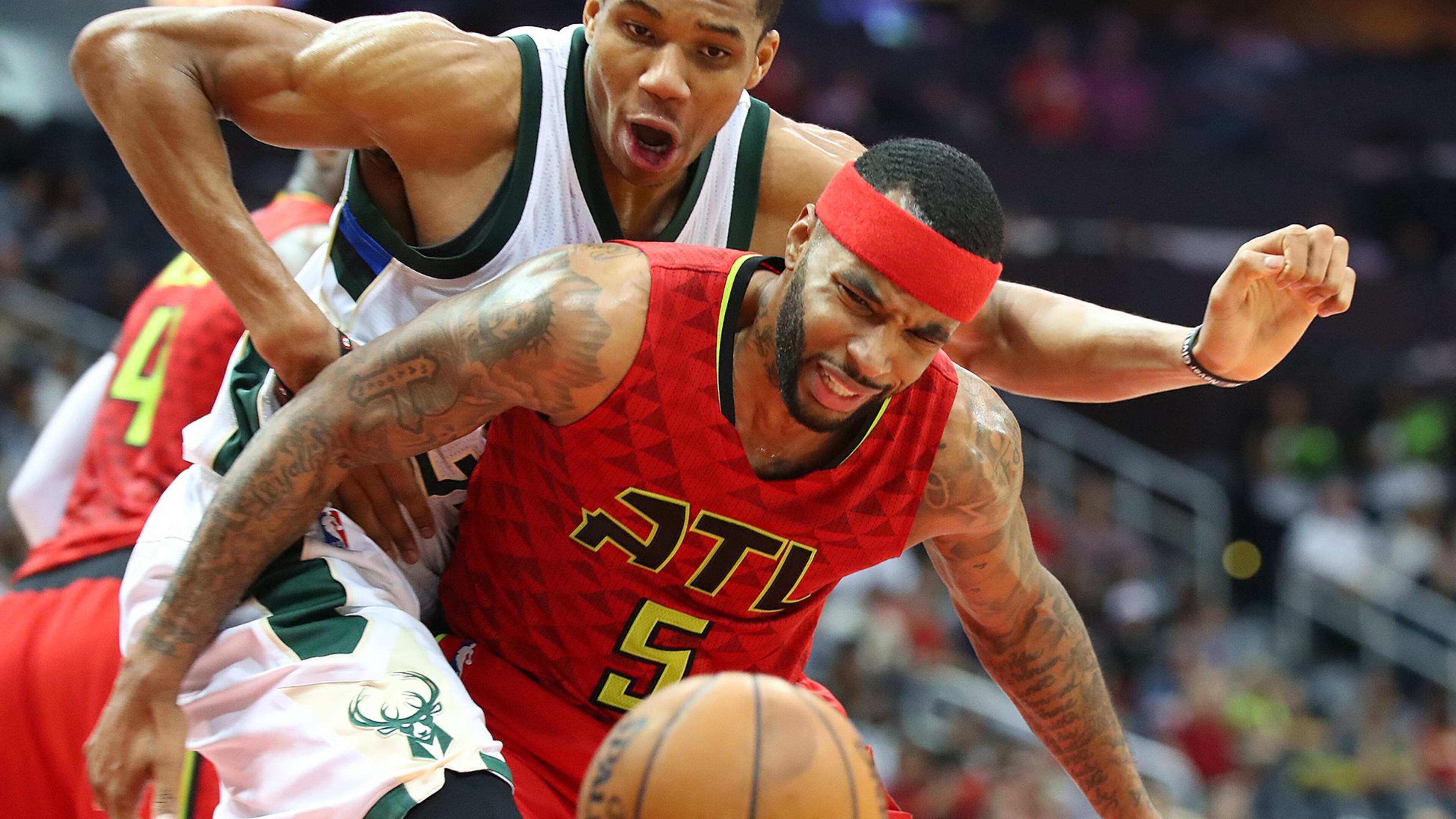 Hawks’ Malcolm Delaney battles to get the turnover from Bucks Giannis Antetokounmpo in a NBA basketball game on Sunday, Jan. 15, 2017, in Atlanta. Curtis Compton/ccompton@ajc.com
