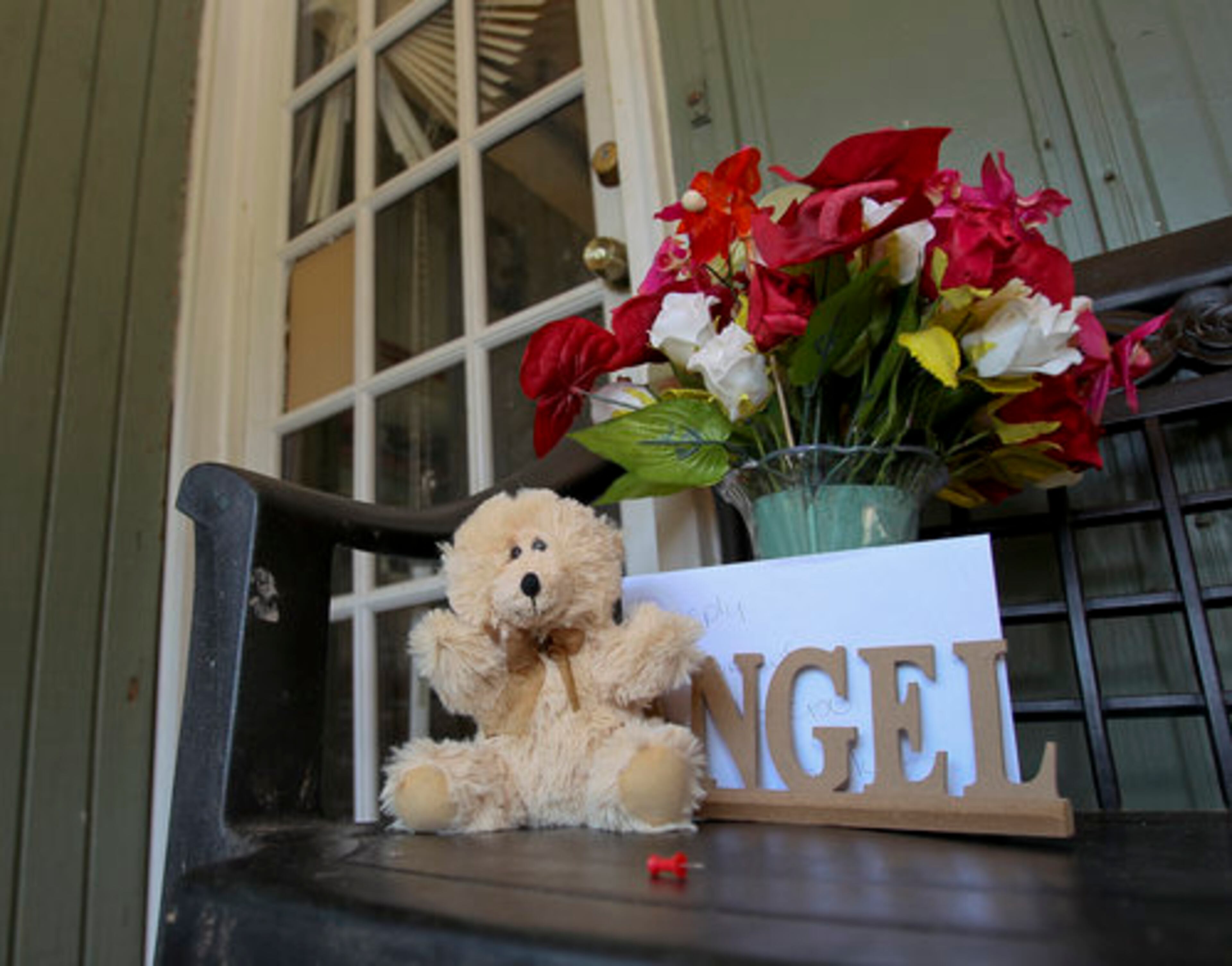 A small memorial sat outside a house in the Eastside Mobile Home Park in Marietta on Friday where a 13-year-old boy was shot and killed by a 16-year-old.