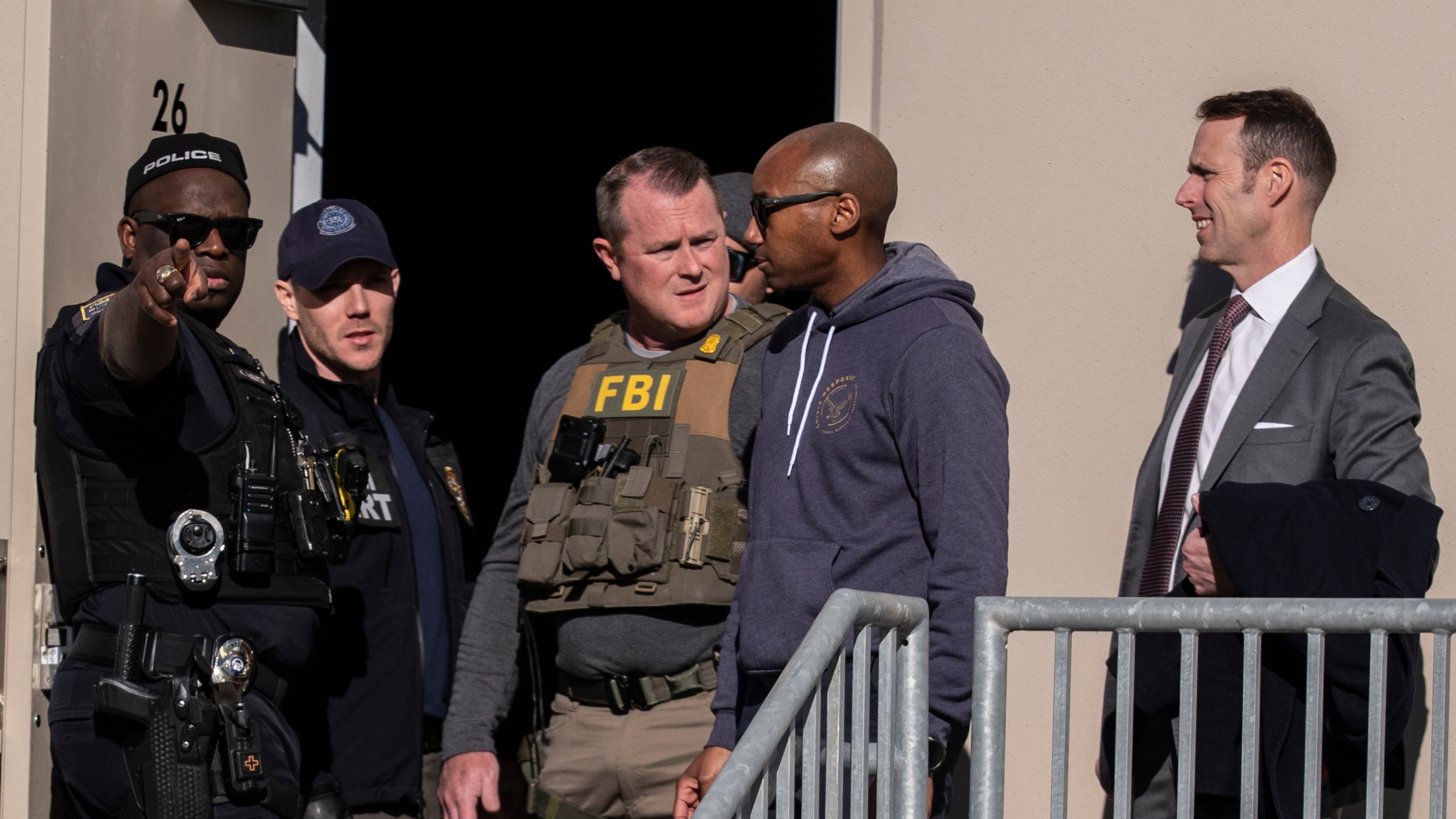 FBI agents are seen at the Fulton County Election Hub and Operation Center, Wednesday, Jan. 28, 2026, in Union City, Ga, near Atlanta. (AP Photo/Mike Stewart)