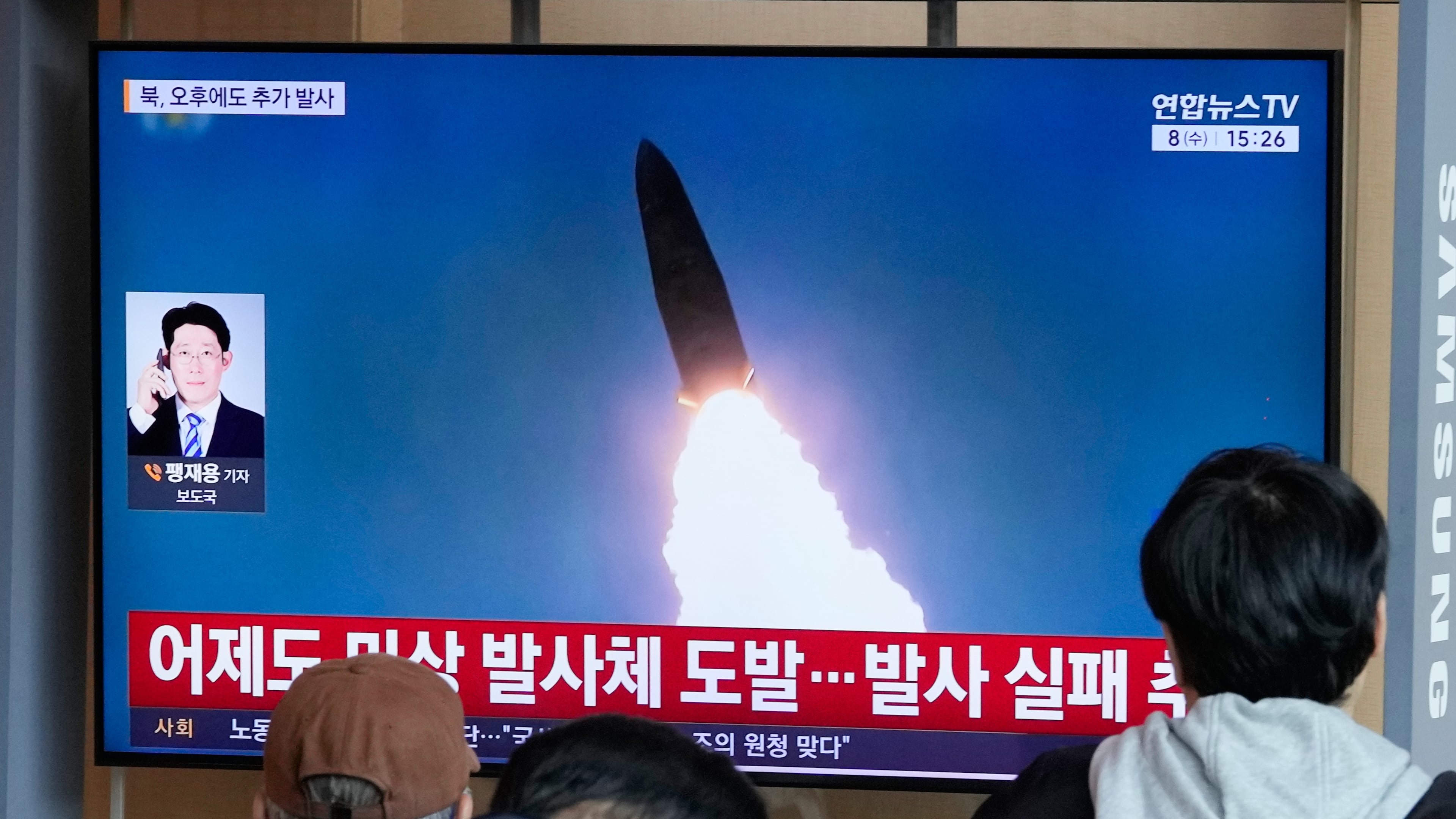 A TV screen shows a file image of North Korea's missile launch during a news program at Seoul Railway Station in Seoul, South Korea, Wednesday, April 8, 2026. (AP Photo/Ahn Young-joon)
