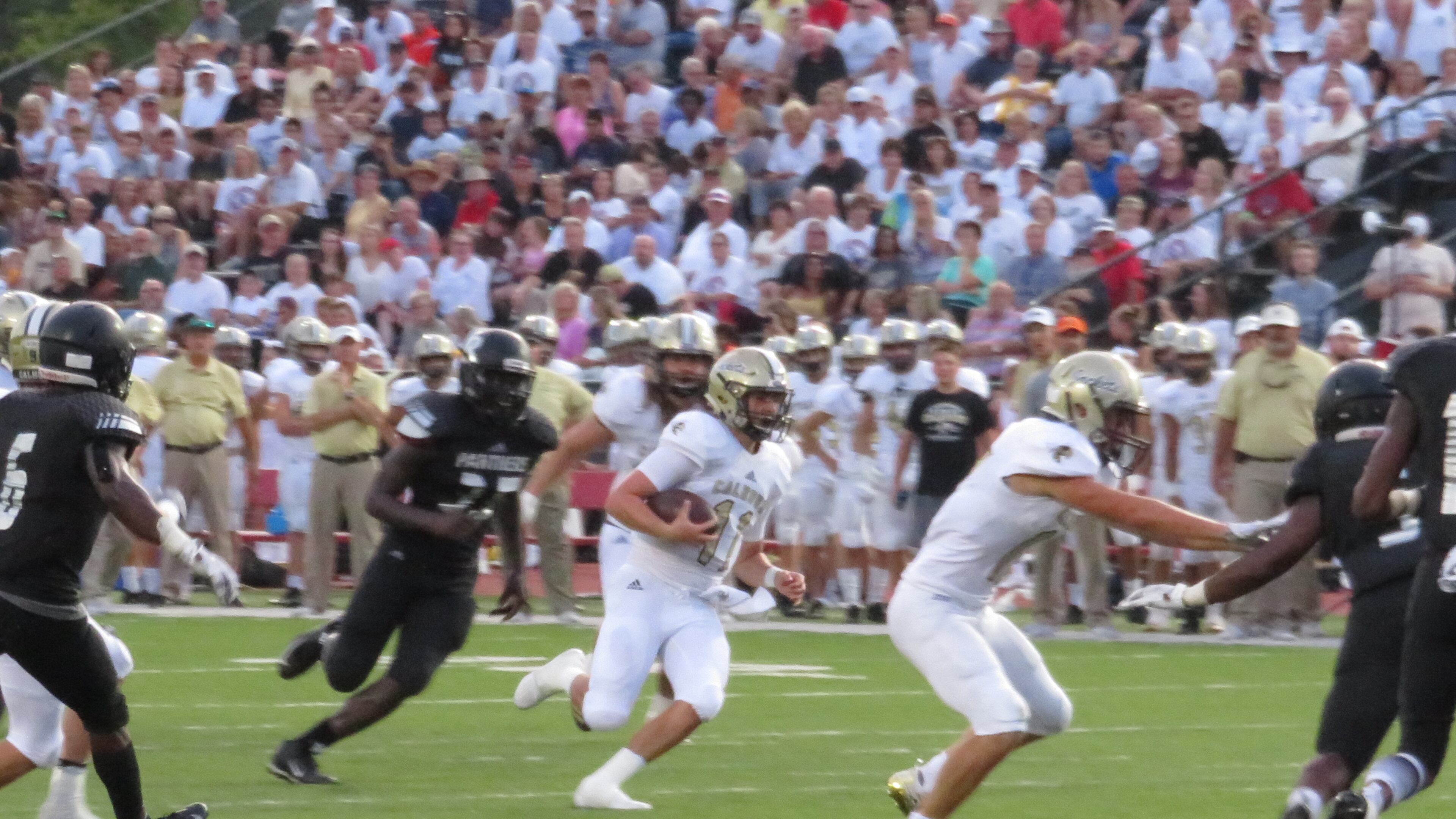 Calhoun Yellow Jackets quarterback Gavin Gray (11) scrambles with the ball in the third quarter against the Ridgeland Panthers on Thursday, Aug. 16, 2018 at Barron Stadium in Rome, Ga., in the 27th annual Corky Kell Classic. (Adam Krohn/special)