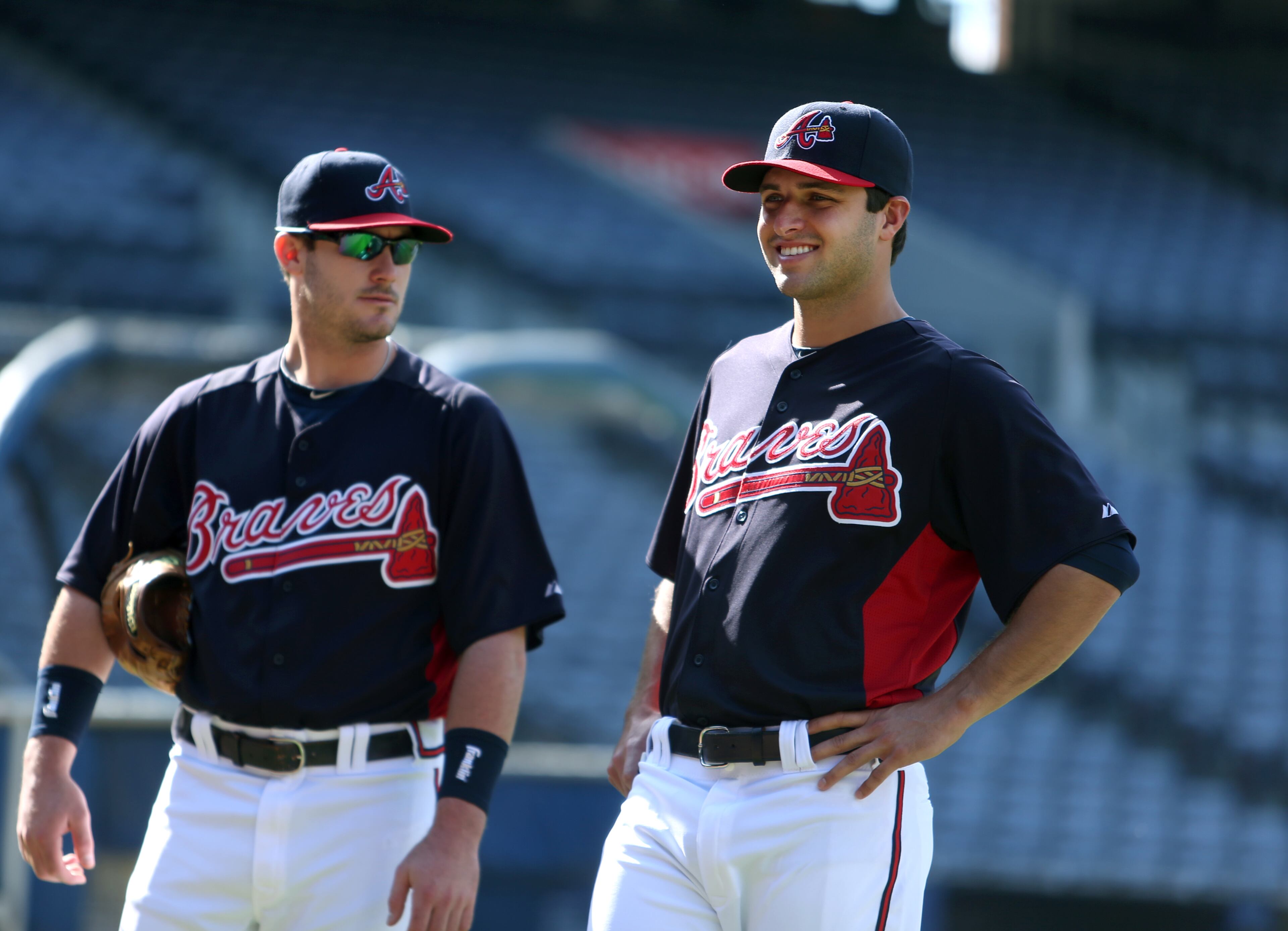 Braves pitcher David Hale, right, talks with outfielder Joey Terdoslavich, left, before their game against the San Diego Padres at Turner Field. JASON GETZ / JGETZ@AJC.COM