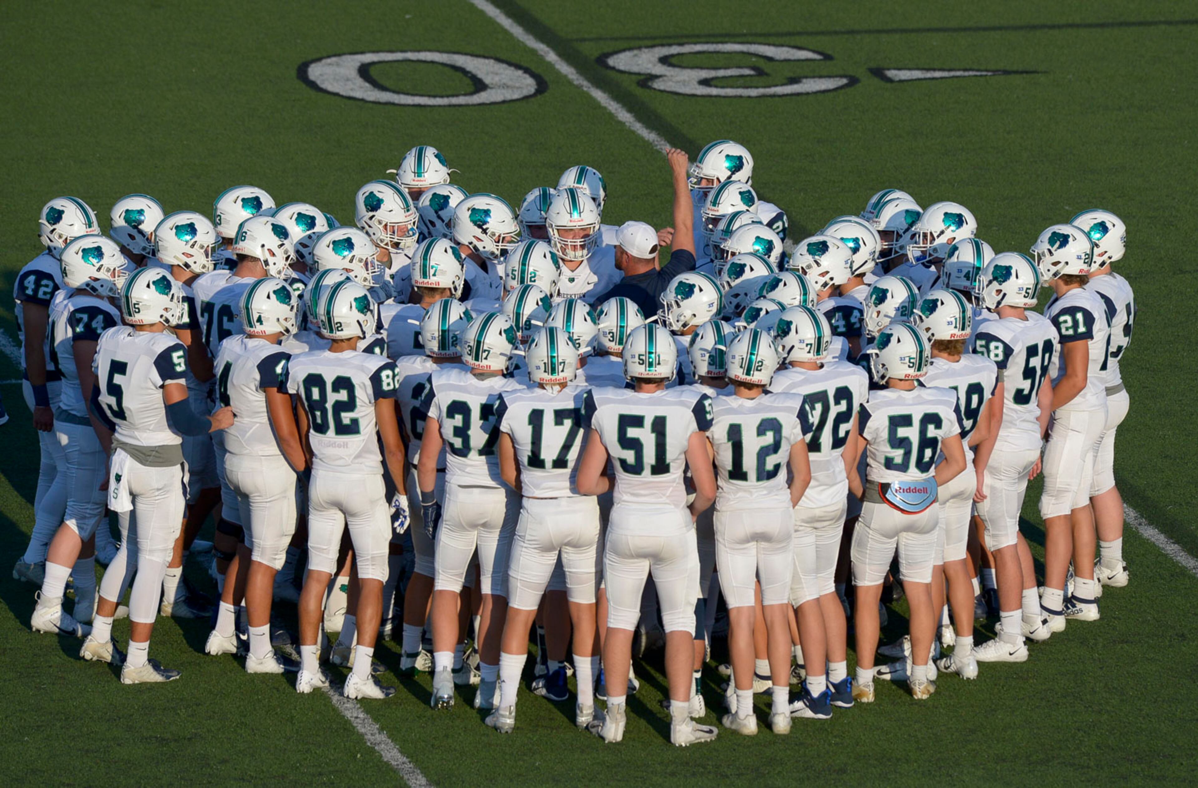 Creekview Grizzlies head coach Trevor Williams (center) rallies his team before the start of their game against the Allatoona Buccaneers Friday. (Daniel Varnado/Special)