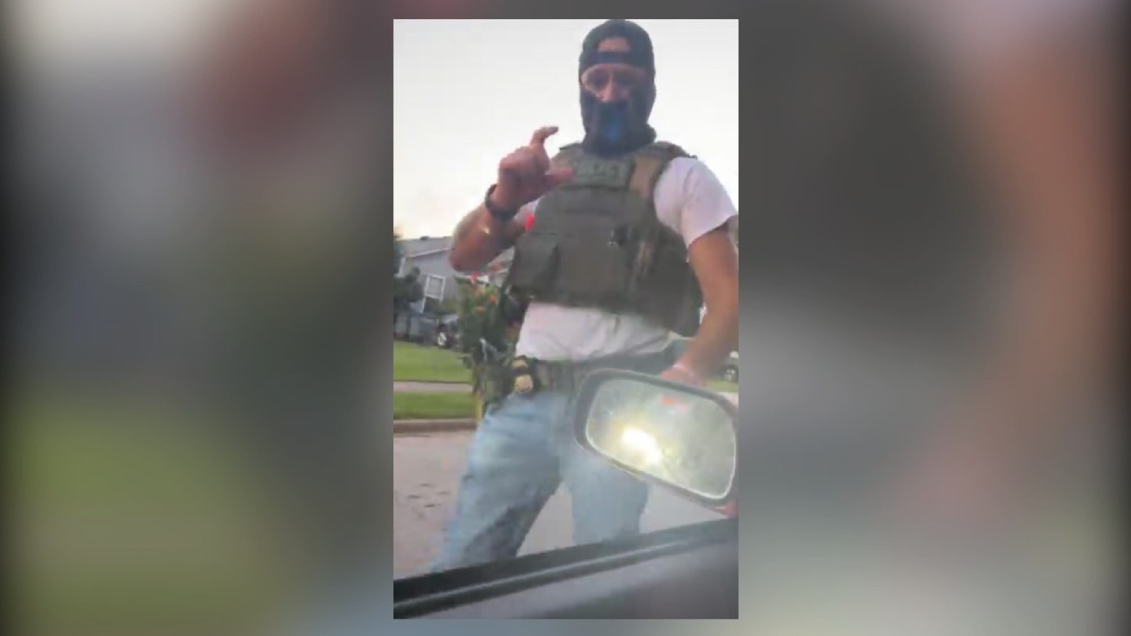 A masked immigration agent asks LaGrange resident Alex Orellana for identification in this screenshot taken from a livestream posted on Facebook on July 7, 2026. (Courtesy of Alex Orellana)