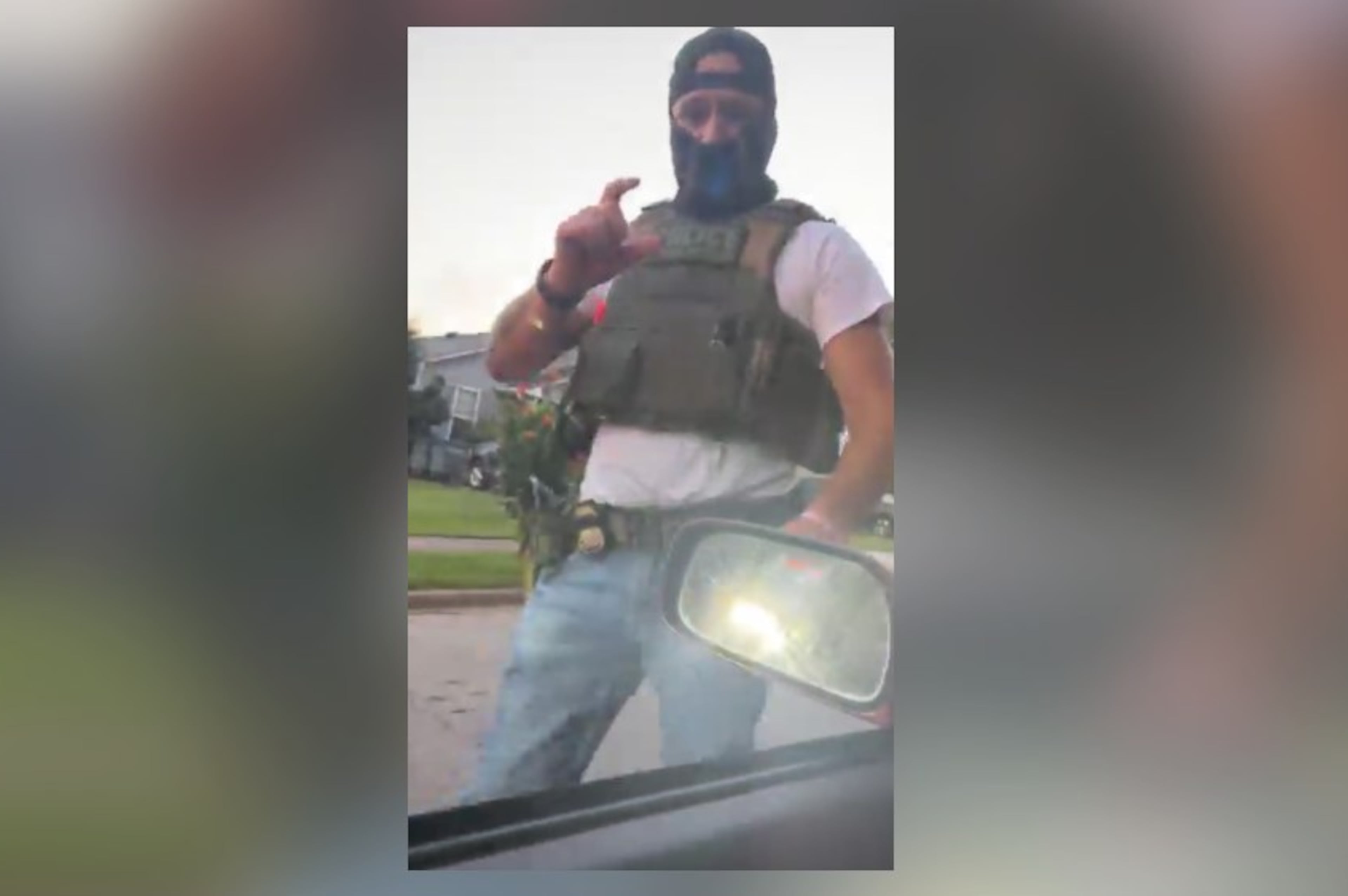 A masked immigration agent asks LaGrange resident Alex Orellana for identification in this screenshot taken from a livestream posted on Facebook on July 7, 2026. (Courtesy of Alex Orellana)
