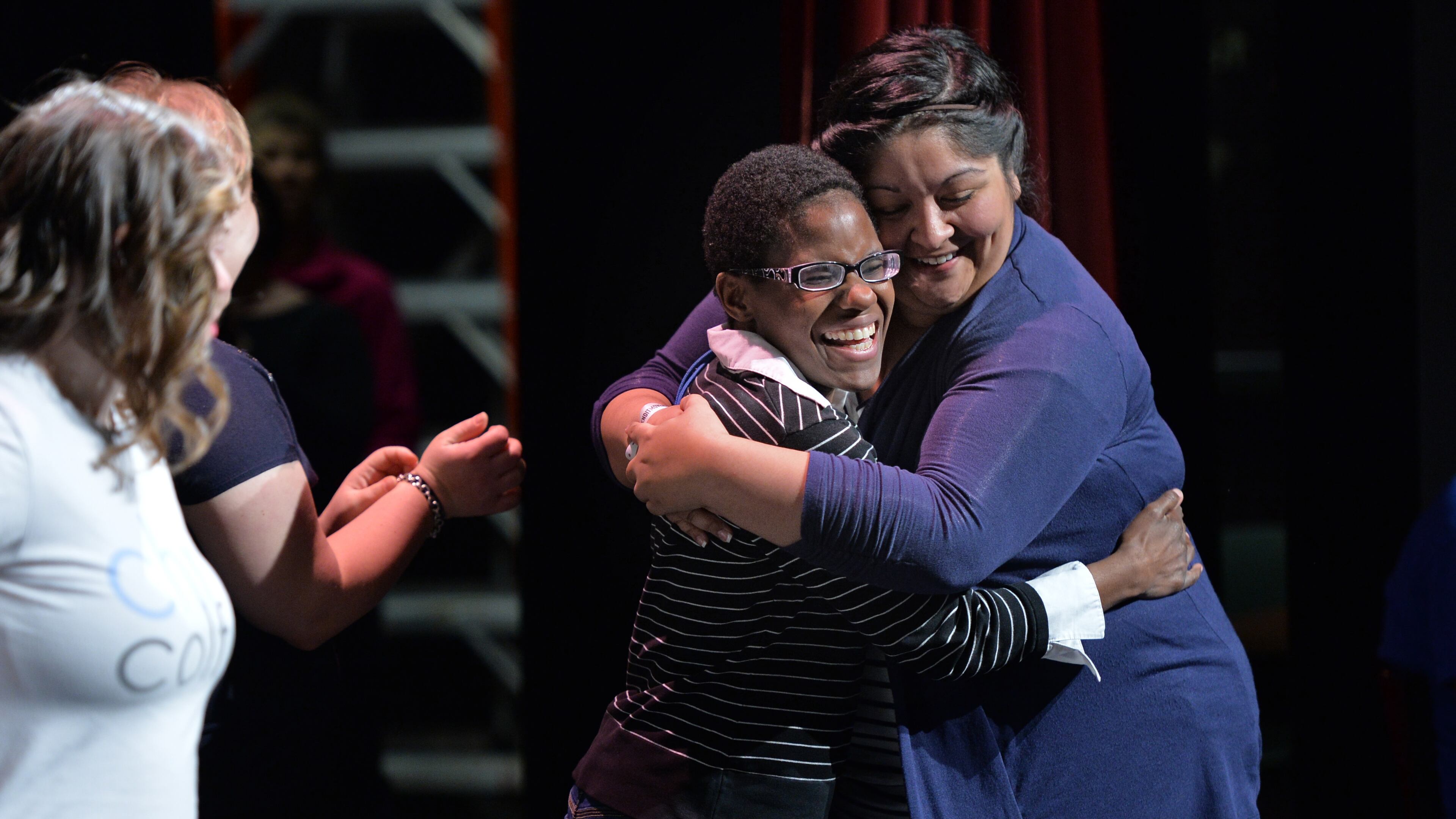 Katherine Burnette gets a hug from actress Katie Cathell (right) before their rehearsal for Little Shop of Horrors at the Jerry's Habima Theatre company, at the Marcus Jewish Community Center of Atlanta in 2014. HYOSUB SHIN / HSHIN@AJC.COM