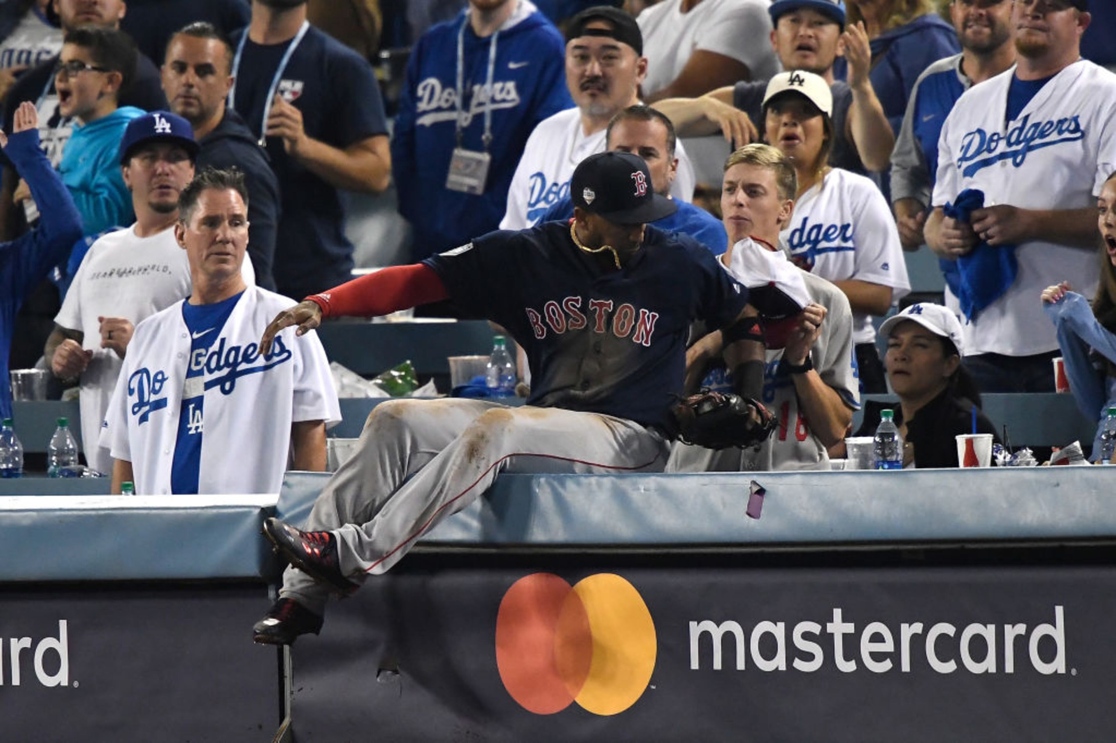 LOS ANGELES, CA - OCTOBER 26: Eduardo Nunez #36 of the Boston Red Sox falls into the stands after catching a ball in foul territory for the second out of the thirteenth inning against the Los Angeles Dodgers in Game Three of the 2018 World Series at Dodger Stadium on October 26, 2018 in Los Angeles, California. (Photo by Kevork Djansezian/Getty Images)