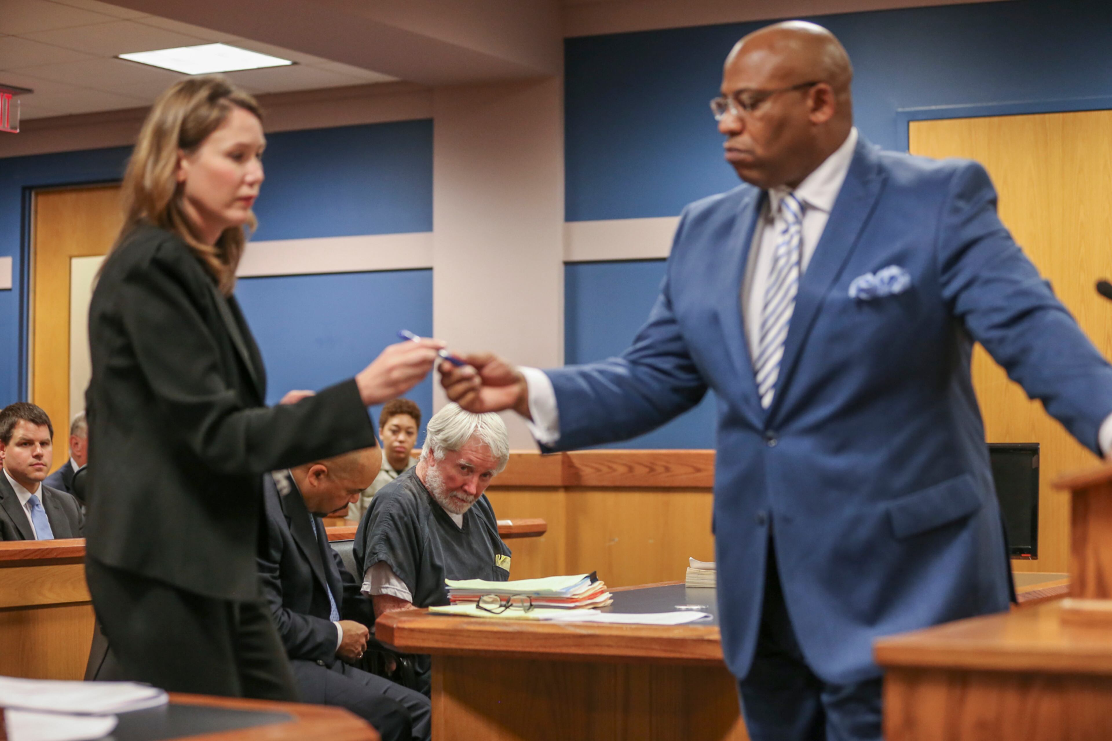 June 6, 2017 Atlanta: Deputy DA Lyndsey Rudder (left) and Fulton Assistant District Attorney Clint Rucker (right) begin the signing as Atlanta attorney, Claud "Tex" McIver (center) was arraigned for murder on Tuesday, June 6, 2017. McIver shot his wife Diane as they rode in their SUV in midtown Atlanta in the fall of 2016. JOHN SPINK/JSPINK@AJC.COM.