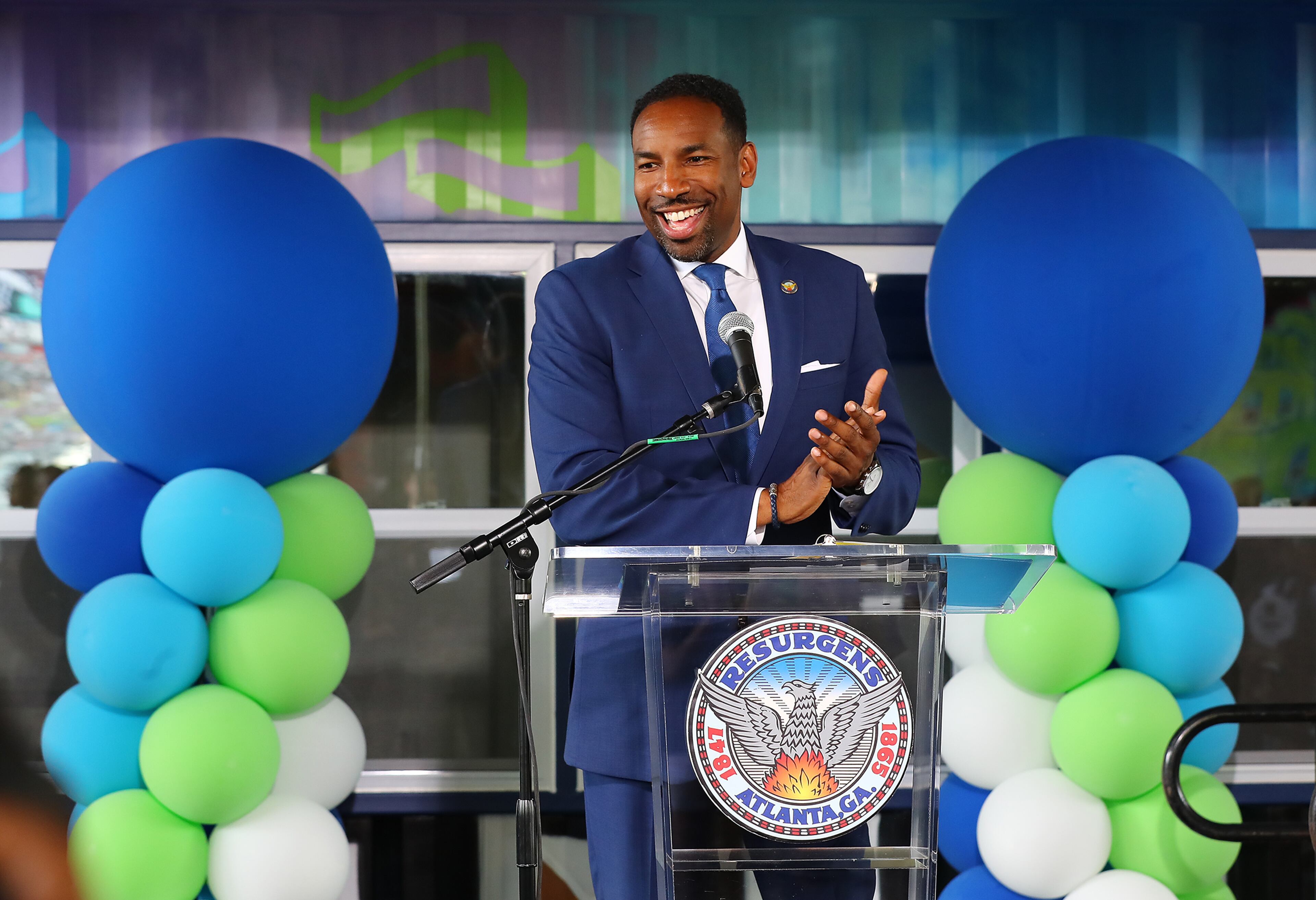 071322 Atlanta: Atlanta Mayor Andre Dickens applauds the opening of the inaugural BeltLine MarketPlace under the Freedom Parkway Bridge, on Wednesday, July 13, 2022, in Atlanta. The new pilot program offers pop-up storefront space for local, Black-owned businesses in refurbished shipping containers along the Atlanta BeltLine in two different areas. “Curtis Compton / Curtis Compton@ajc.com”