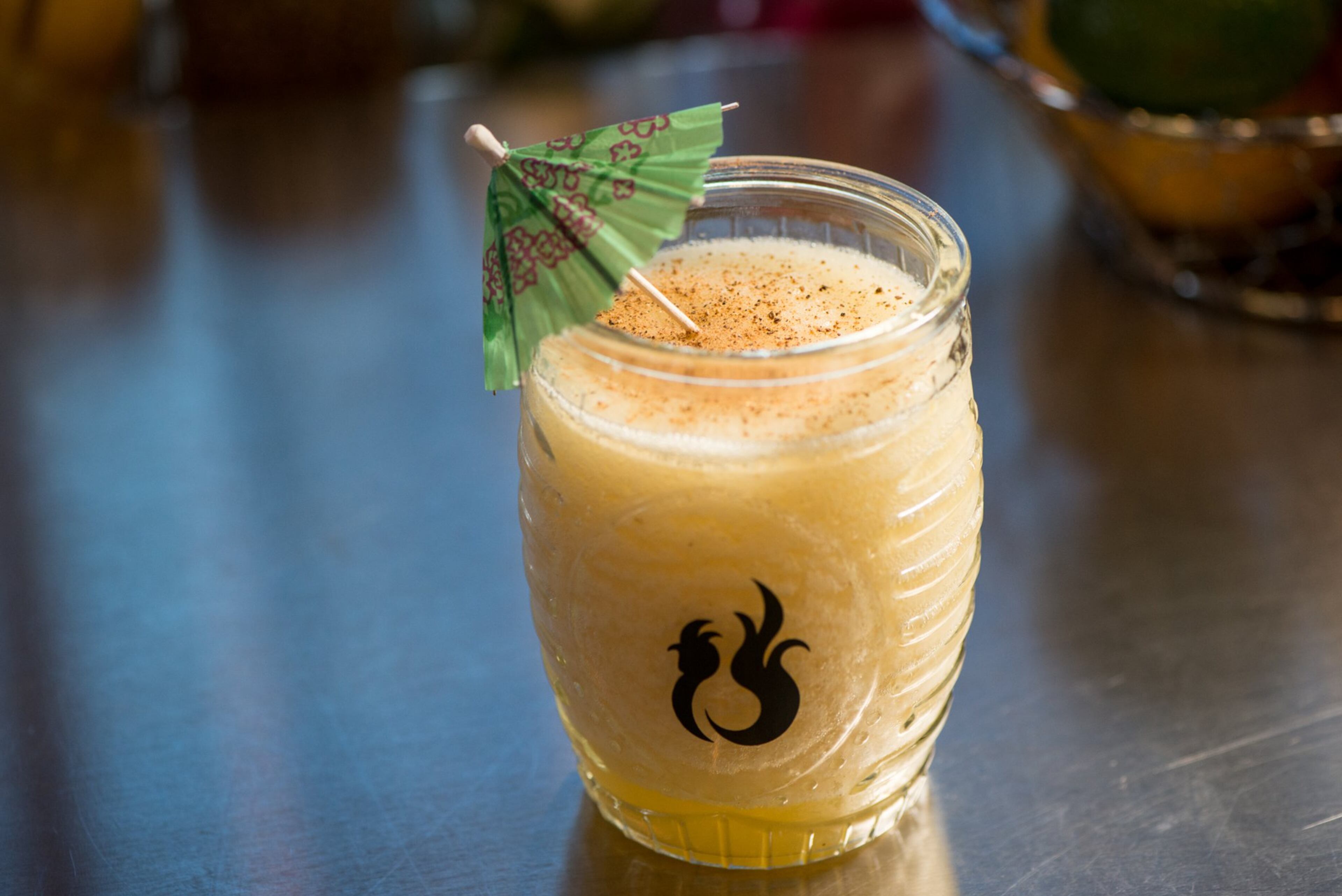 One Rooster Toasty Pineapple frozen cocktail with roasted pineapple, gold tequila, Amargo Chuncho bitters, brown sugar, and cinnamon. Photo credit - Mia Yakel.