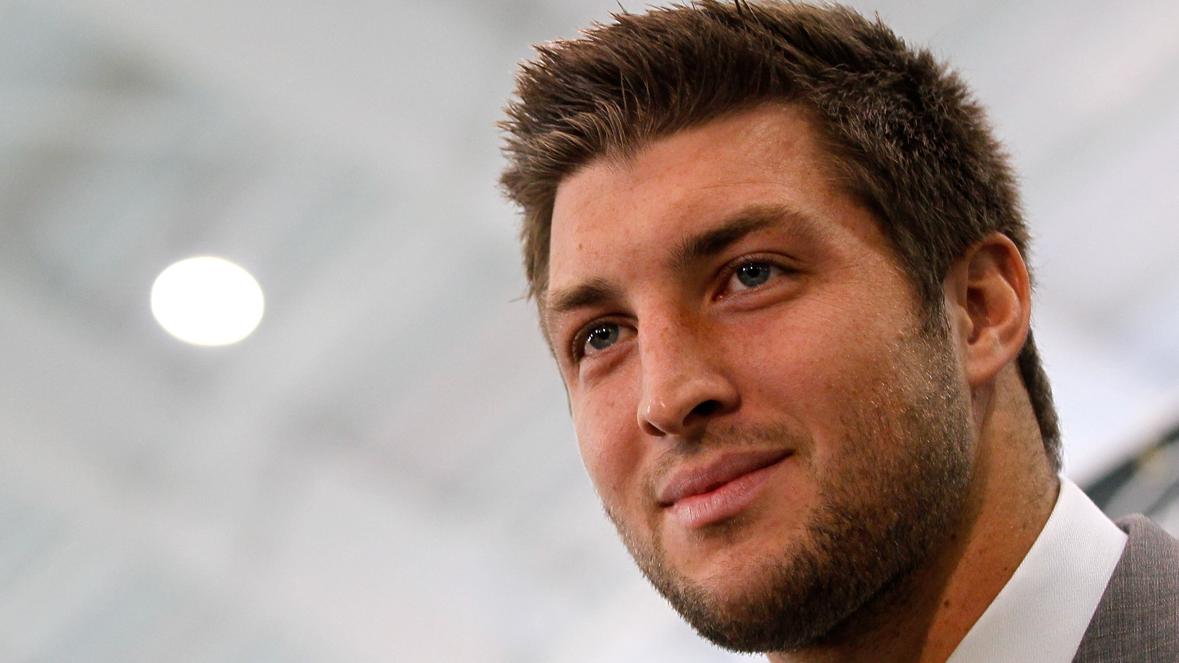 Quarterback Tim Tebow addresses the media as he is introduced as a New York Jet at the Atlantic Health Jets Training Center on March 26, 2012 in Florham Park, New Jersey. (Photo by Mike Stobe/Getty Images)