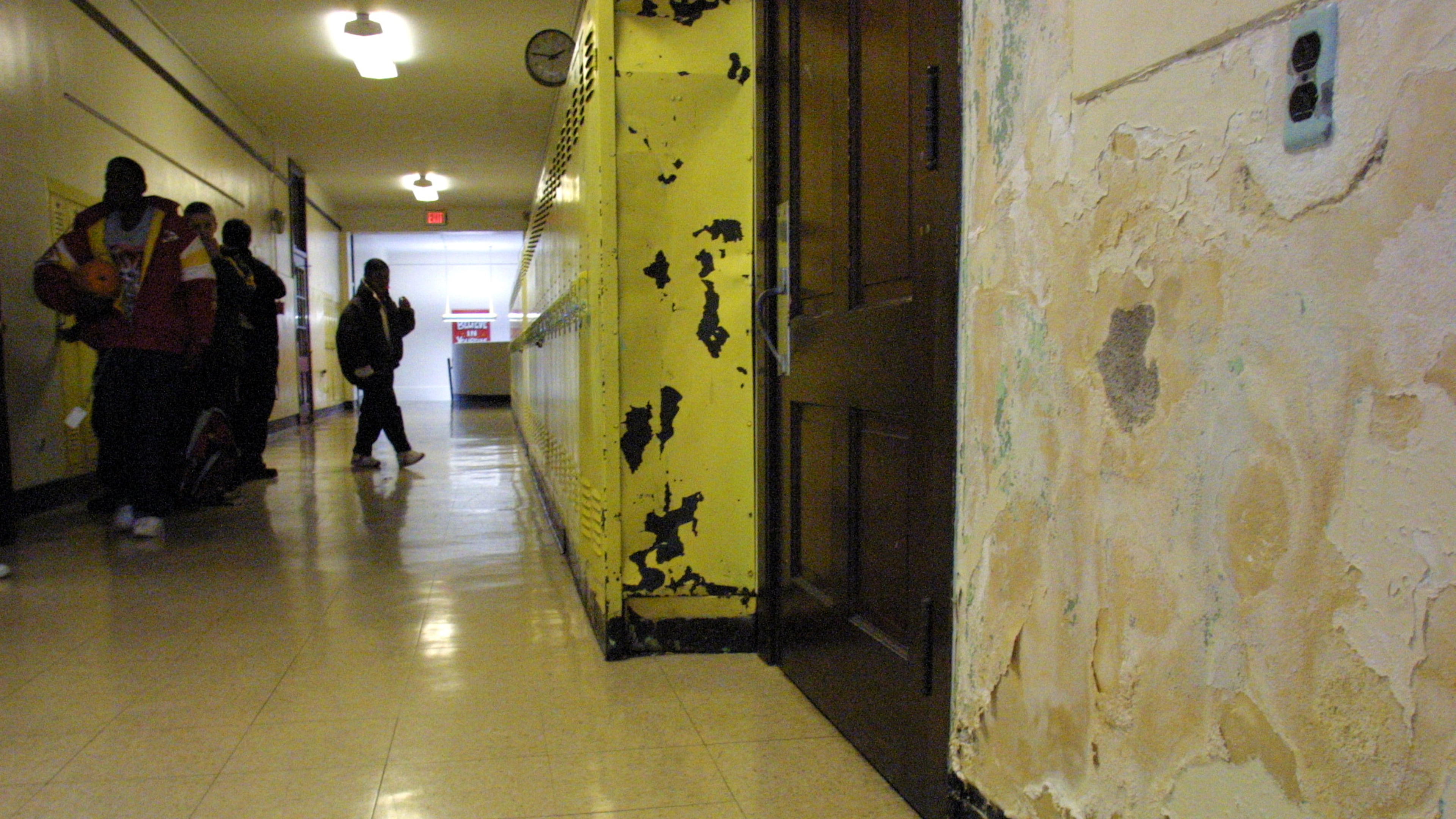 10/29/02 -- 1031arch-p -- Crumbling plaster walls and beat-up lockers are among the signs of deterioration at Kiser Middle School.