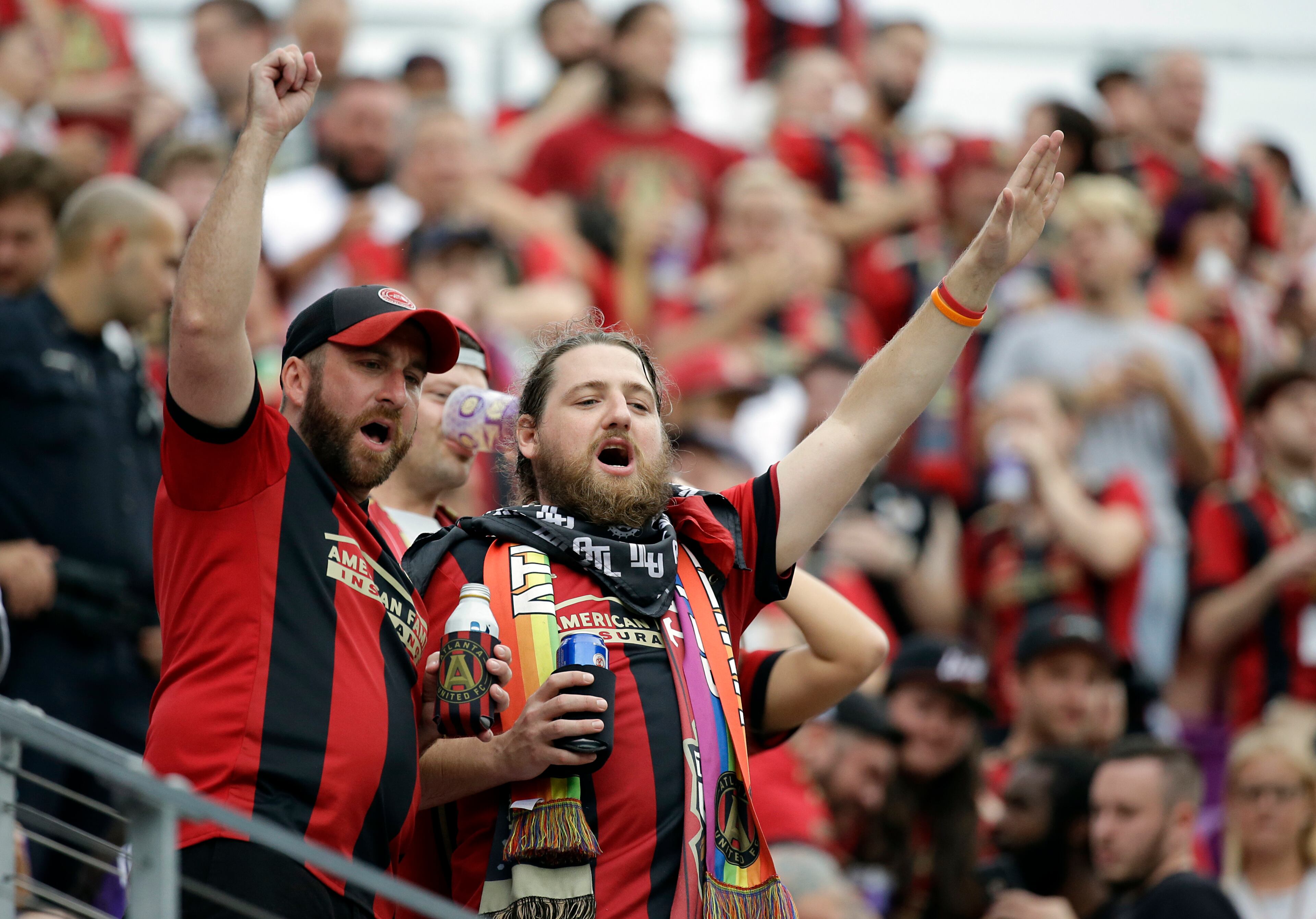Atlanta United fans cheer during the first half of an MLS soccer match between Orlando City and Atlanta United, Friday, July 21, 2017, in Orlando, Fla. (AP Photo/John Raoux)