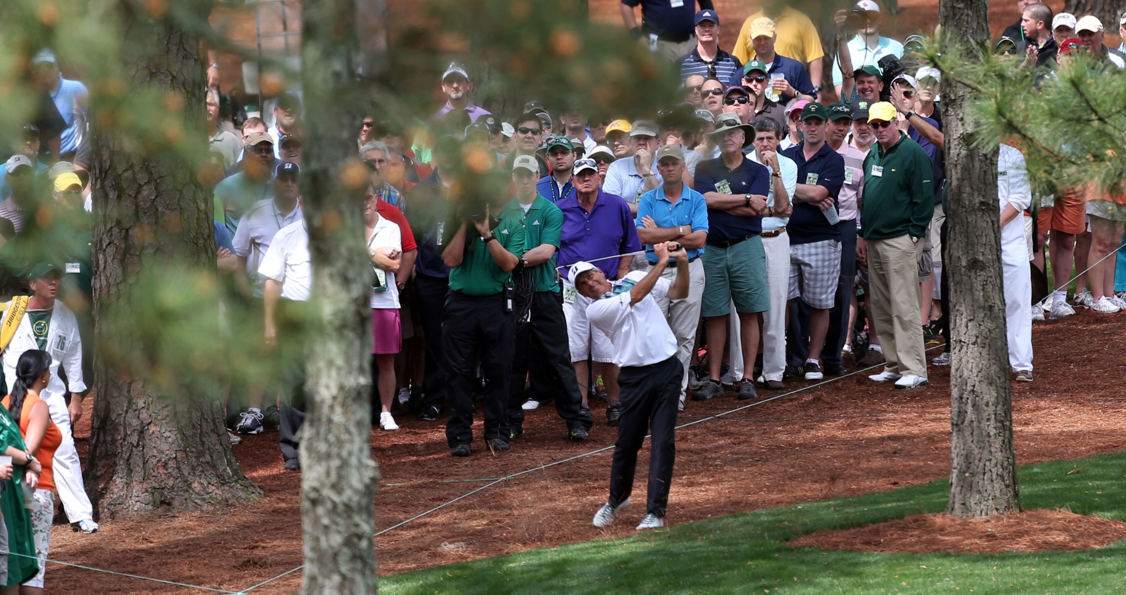 Fred Couples hits from the rough on #7, where he made double bogey during the second round in the Masters Tournament on Friday April 12 2013. JASON GETZ / JGETZ@AJC.COM