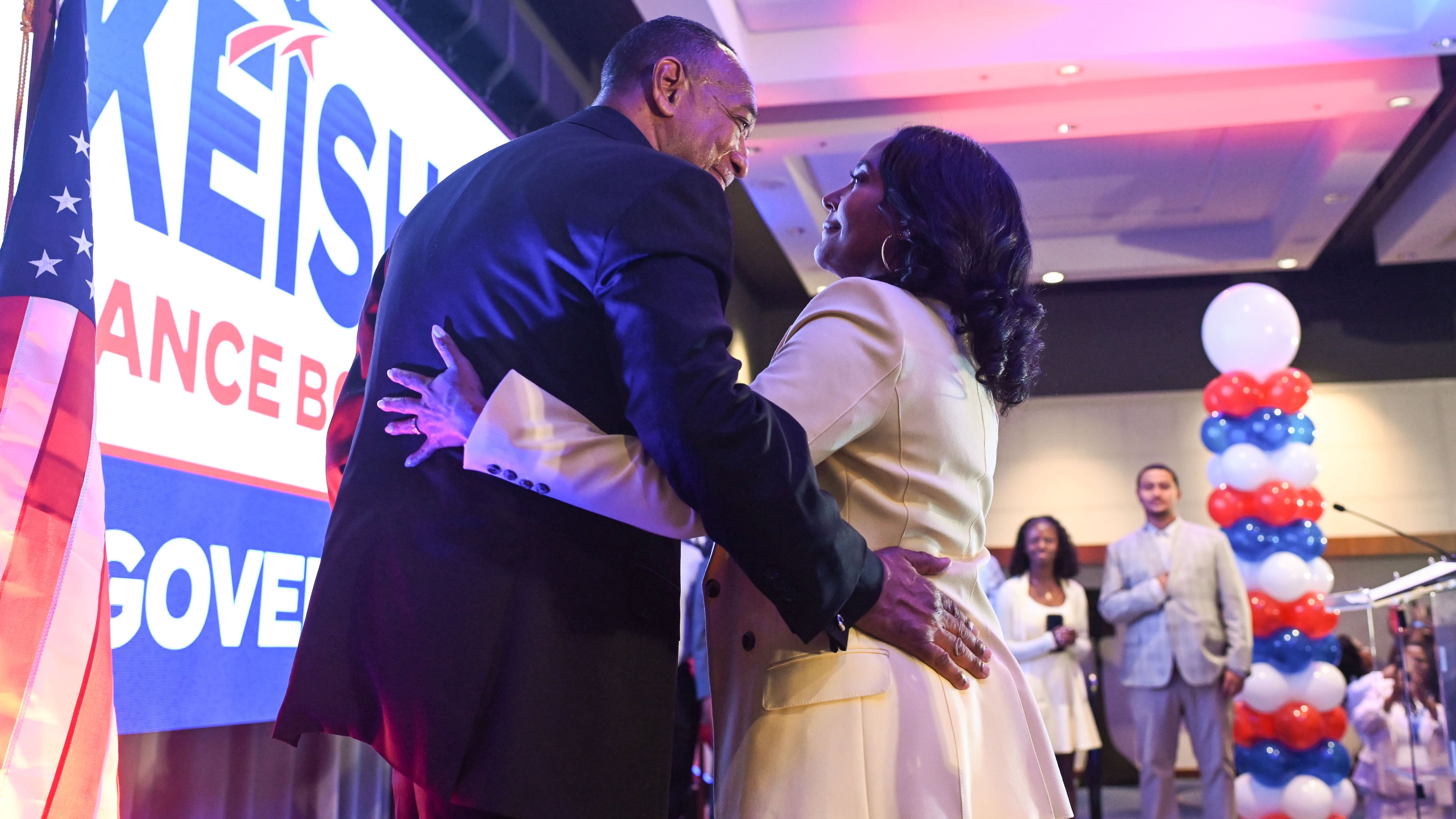 Keisha Lance Bottoms, the Democratic nominee for governor in Georgia, hugs her husband Derek after winning the primary on Tuesday. (Natrice Miller/AJC)