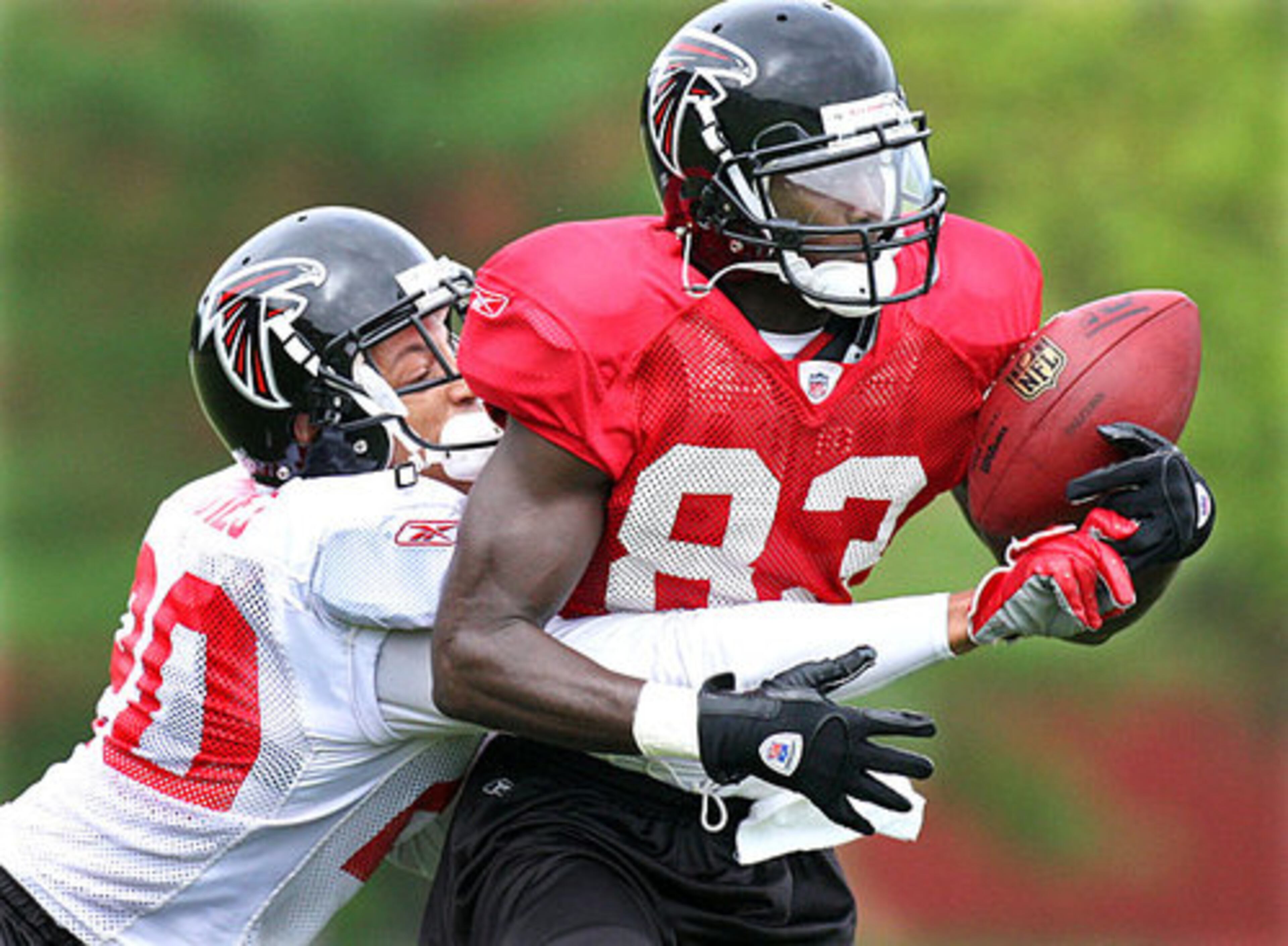Cornerback Brent Grimes breaks up a pass to wide receiver Harry Douglas.