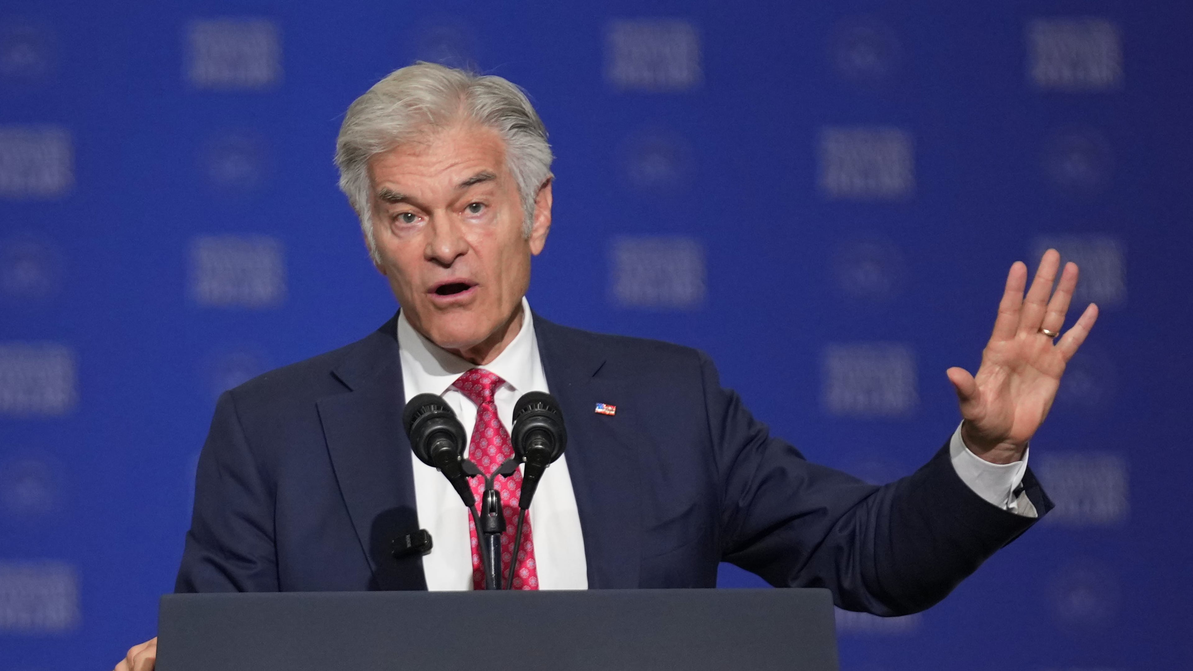 Centers for Medicare & Medicaid Services administrator Dr. Mehmet Oz speaks before Vice President JD Vance at the Wisconsin Air National Guard facility at Milwaukee Mitchell International Airport, Wednesday, July 8, 2026, in Milwaukee. (AP Photo/Mark Schiefelbein, Pool)