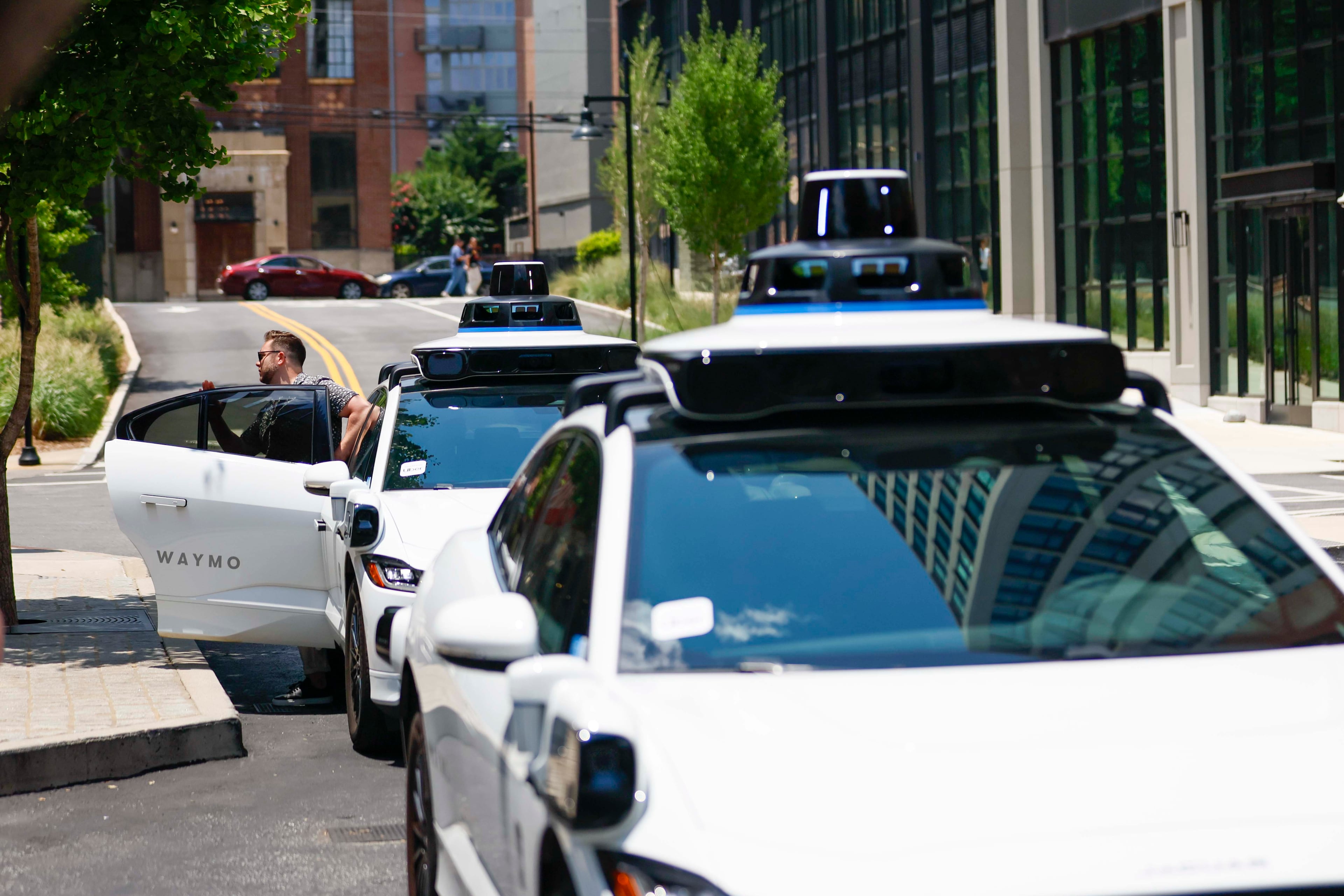 A pasanger is seen getting out of the self-driving Waymo vehicle at Ponce City Market in Atlanta on Monday, June 23, 2025.
(Miguel Martinez/ AJC)