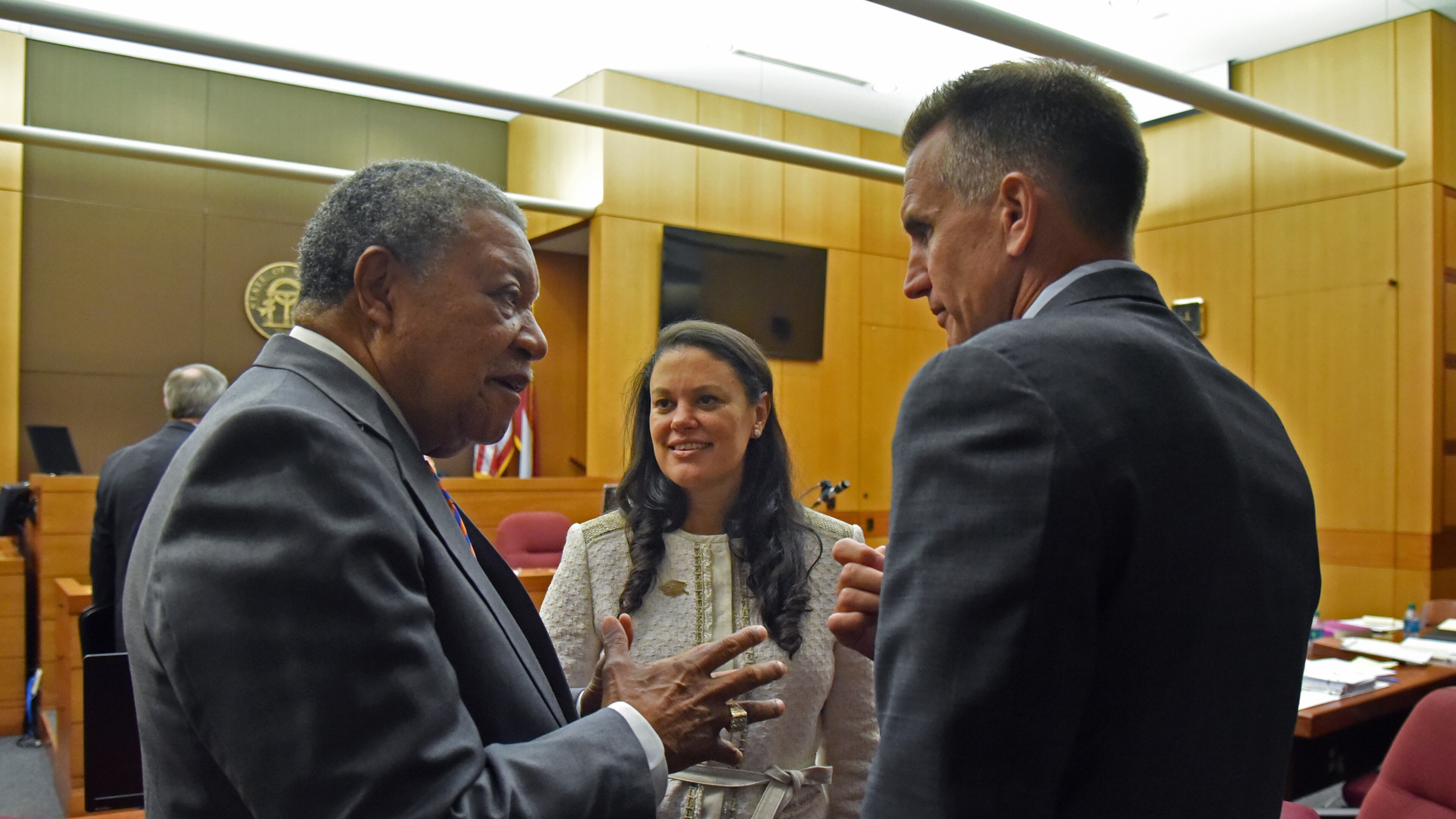 Robb Pitts (left), chairman of Fulton County Board of Commissioners, celebrates with Meria Carstarphen, superintendent of Atlanta Public Schools, and Jeff Rose (right), superintendent of Fulton County Schools after Judge Alan Harvey ruled to allow Fulton County to collect tax money on Tuesday, August 14, 2018. HYOSUB SHIN / HSHIN@AJC.COM