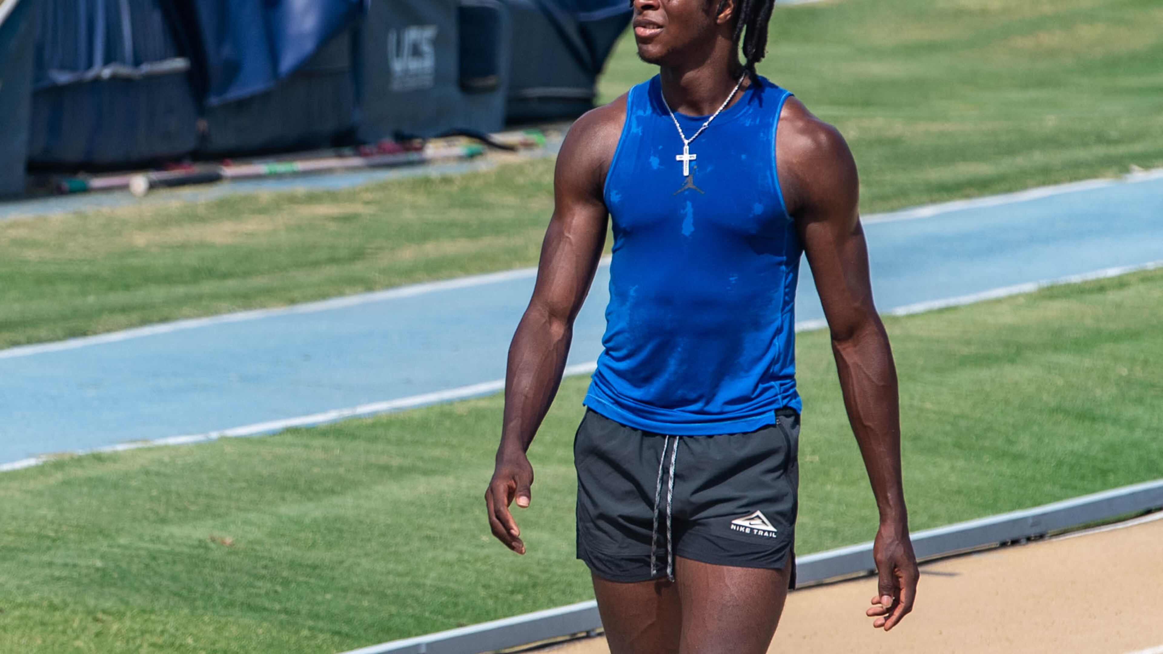 Solomon Finley cools down while at a track and field practice at the Georgia Institute of Technology on a sunny morning in the rising heat on Wednesday, July 19, 2023.