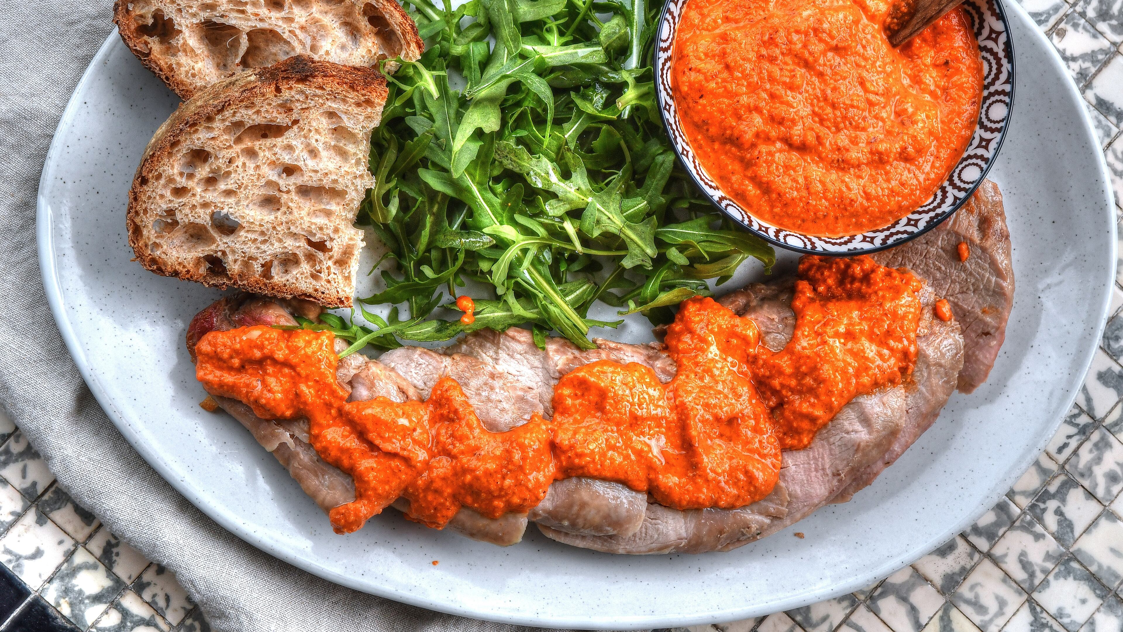 Roast Pork Tenderloins with Shortcut Romesco Sauce. (Chris Hunt for The Atlanta Journal-Constitution)