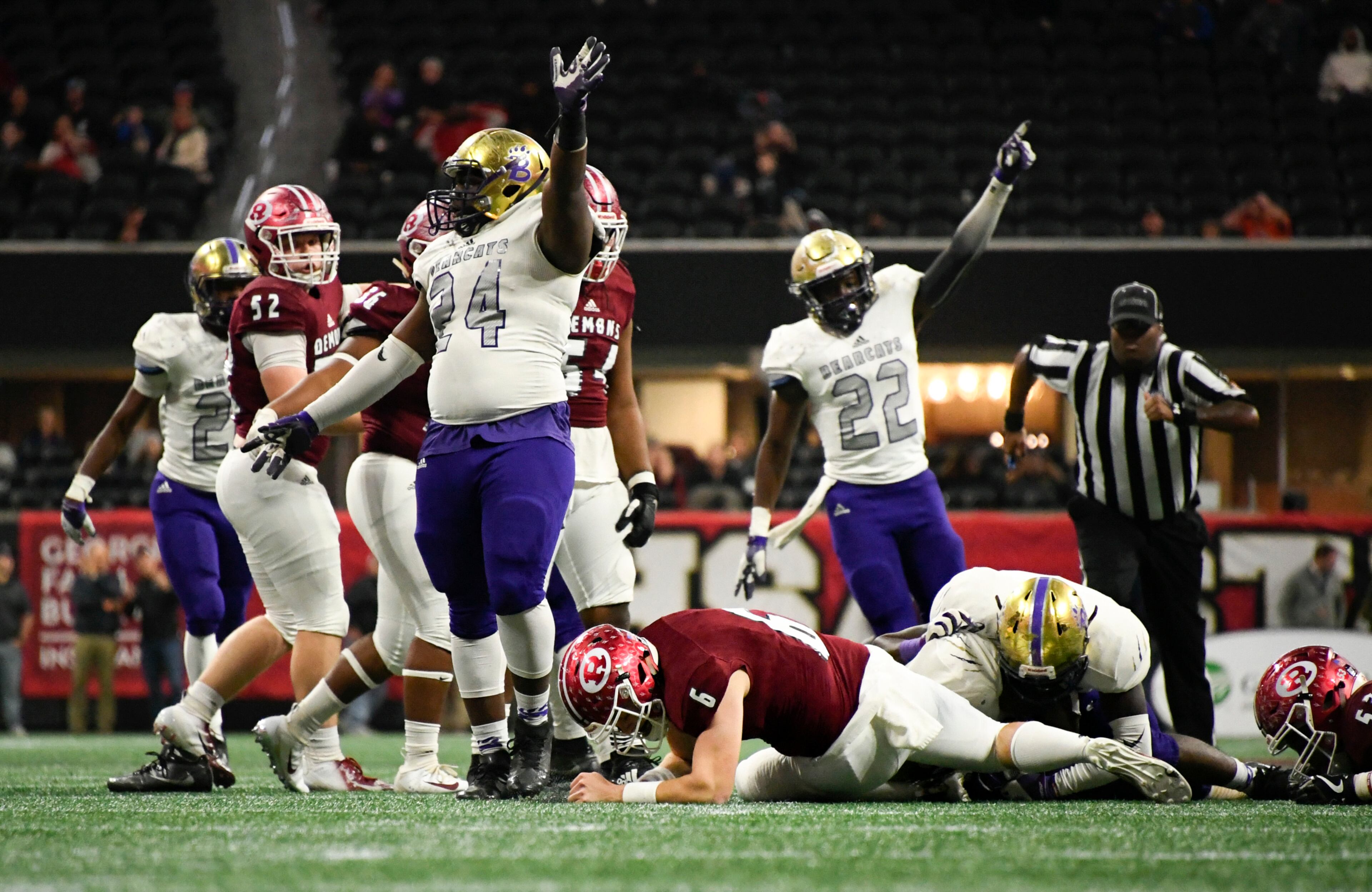 Bainbridge's Tim Allison (24) and Bryce Worthy (22) celebrate a recovery of a fumble by Warner Robins' Dylan Fromm (6) during their class 5A high school championship football game, Tuesday, Dec., 11, 2018, at Mercedes-Benz Stadium, in Atlanta. (John Amis/Special)