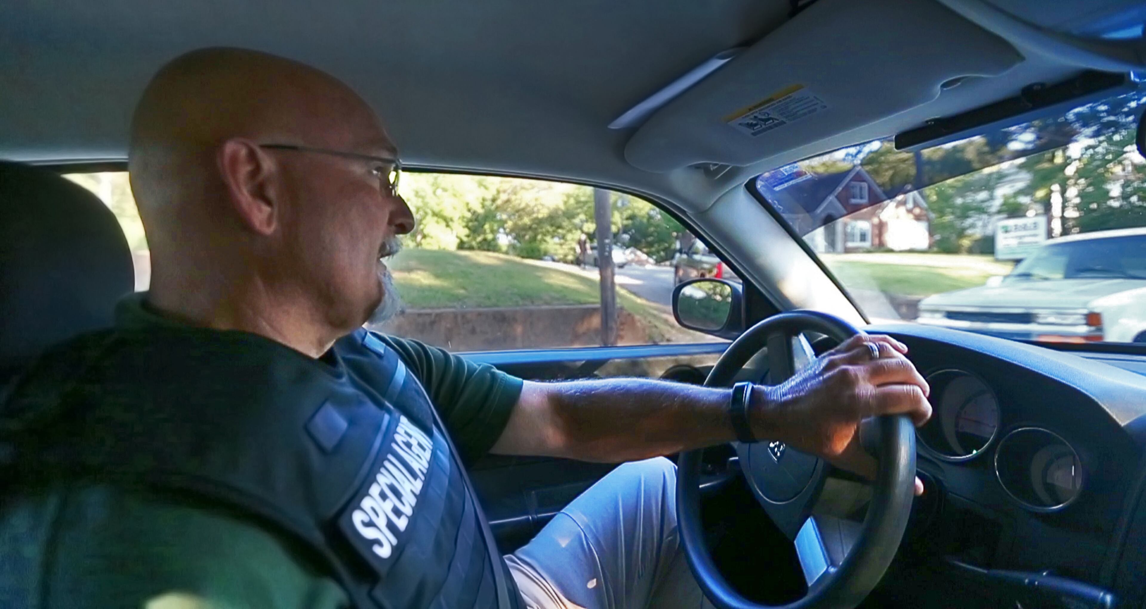 May 6, 2016 Hapeville: Special Agent Jeff Mitchell prepares to turn into the business' driveway during the raid. Special agents with The Georgia Department of Revenue office of special executed a search warrant on Friday, May 6, 2016 at B & B Accounting & Tax Services at 3335 Dogwood Dr. in Hapeville where they entered and confiscated computers and office records. Hapeville city councilwoman Ruth Barr who owns the business was indicted in November 2015 for theft for stealing $109,000 from a retirement account of a relative. But an investigation by the AJC/Channel 2 reveals Barr has a trail of fraud and mishandling other people's money. A tax preparer for three decades, the state is now investigating her based on reporter's questions about her past. JOHN SPINK / JSPINK@AJC.COM Read the story here: http://www.myajc.com/news/news/crime-law/hapeville-official-leaves-trail-of-fraud-allegatio/nrLFb/