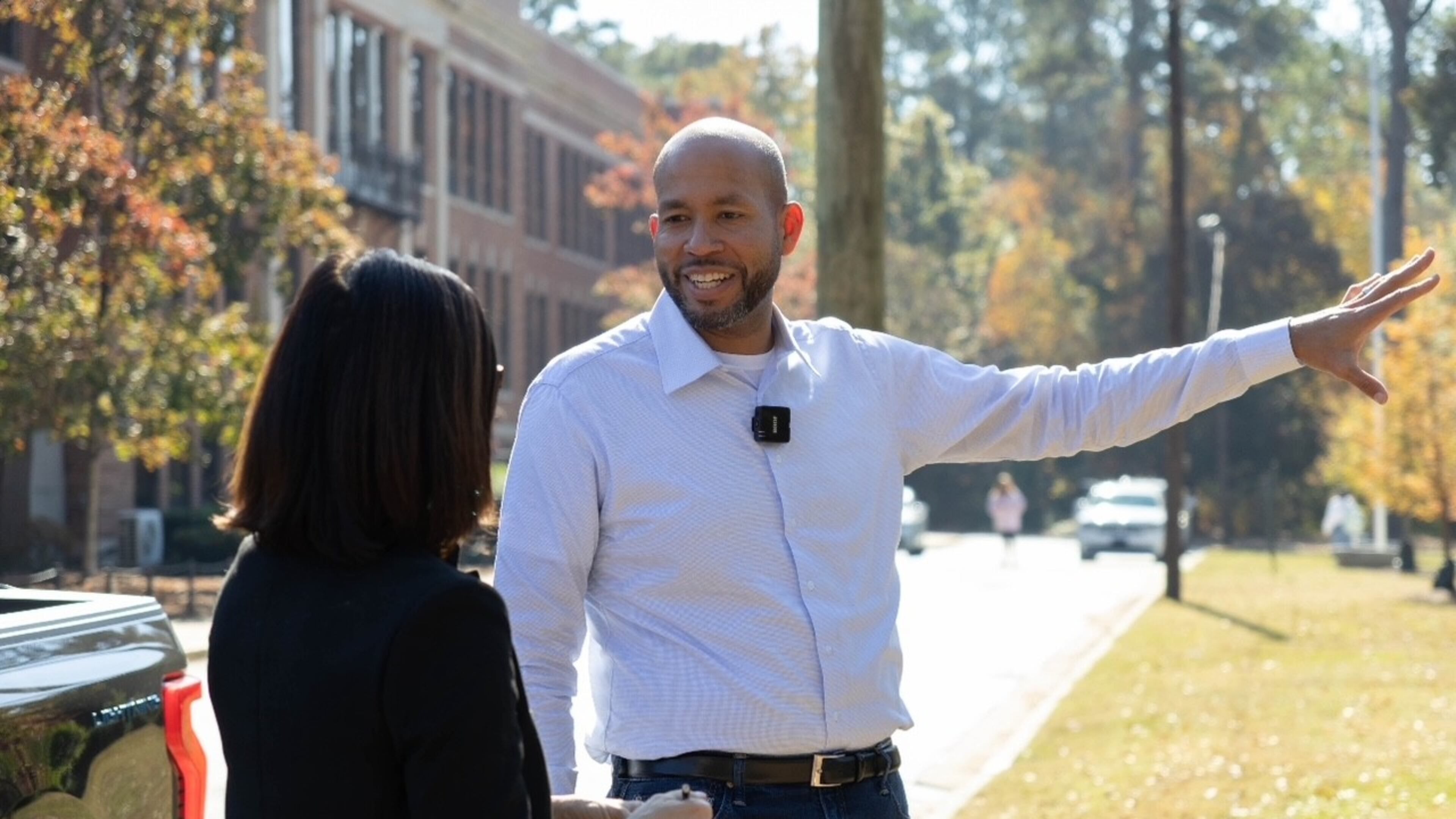 Former state Sen. Jason Esteves' Democratic campaign for governor is focused on economic opportunity. He said attending Columbus High School (in background) opened opportunities that friends at other Columbus schools did not have. (Anna Girzone for the AJC)