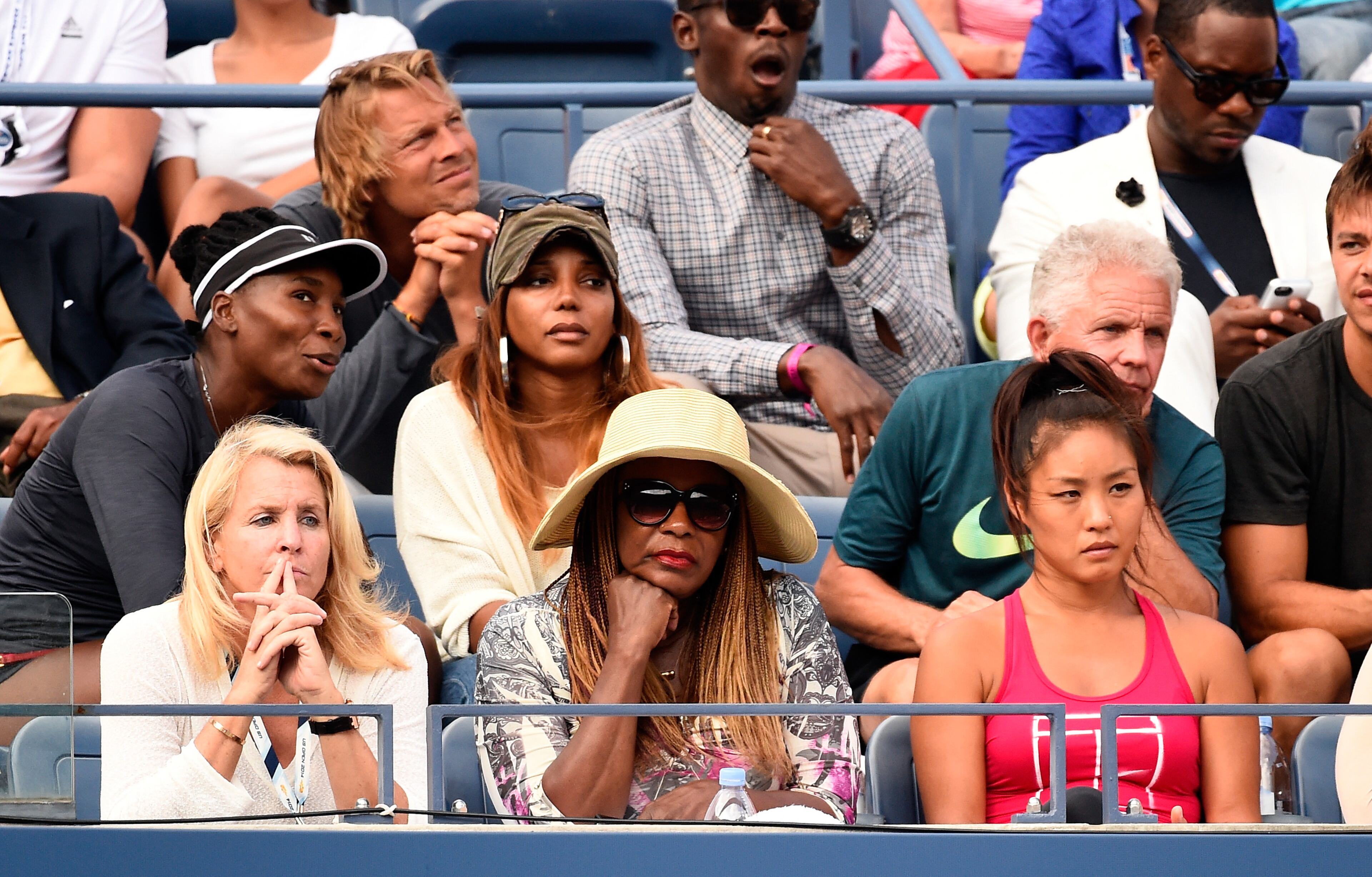 NEW YORK, NY - SEPTEMBER 05: Mother Oracene Price (C) and sister Venus Williams (TL) watch Serena Williams of the United States play against Ekaterina Makarova of Russia during their women's singles semifinal match on Day Twelve of the 2014 US Open at the USTA Billie Jean King National Tennis Center on September 5, 2014 in the Flushing neighborhood of the Queens borough of New York City. (Photo by Alex Goodlett/Getty Images)