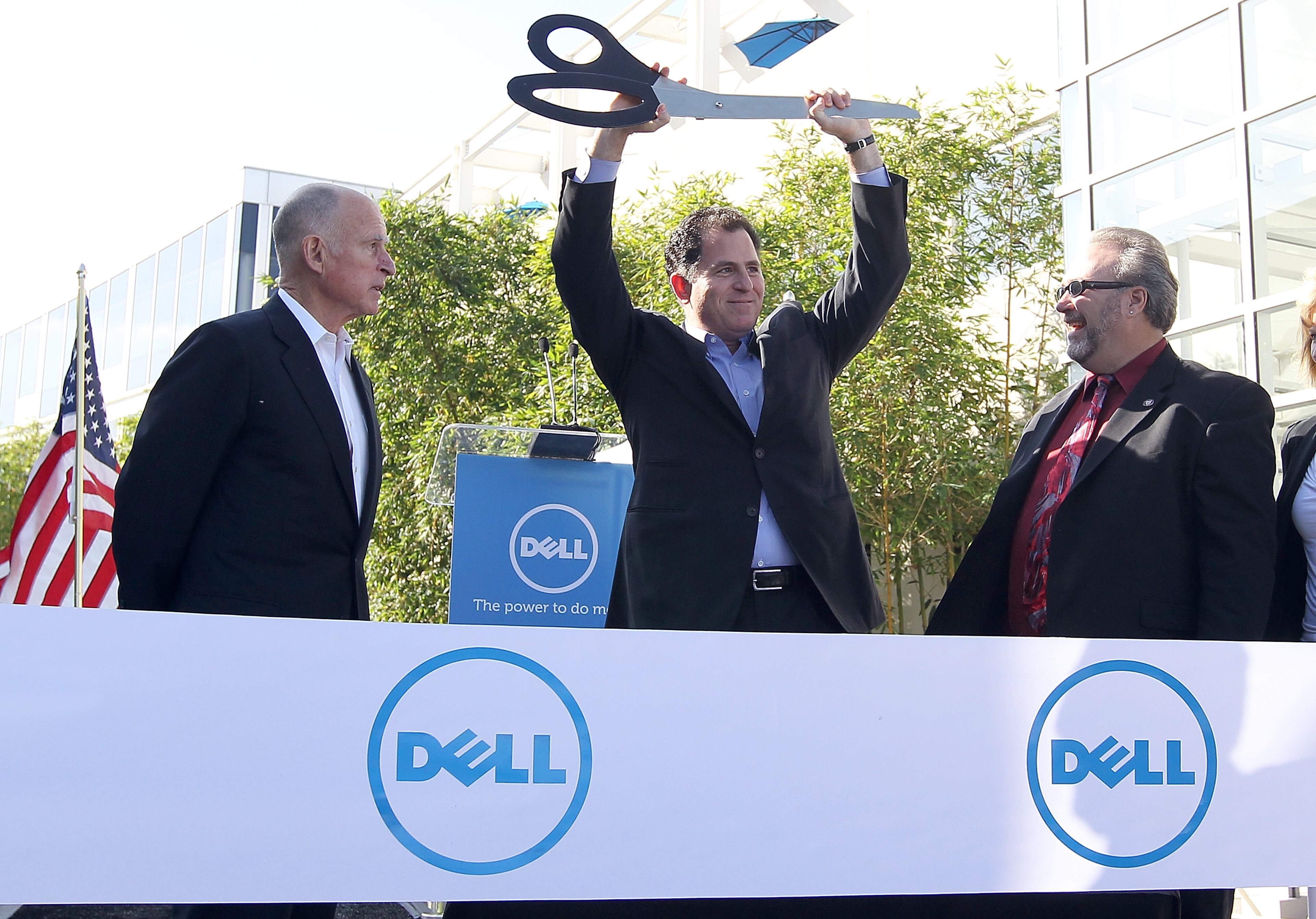 Forbes recently released its list of the 400 richest Americans. Keep clicking to see who made the top 25. Here, Dell chairman and CEO Michael Dell (center) holds up a giant pair of scissors as California Gov. Jerry Brown (left) and Santa Clara mayor Jamie Matthews (right) look on during a ribbon-cutting ceremony to open the new Dell research and development facility on Oct. 19, 2011, in Santa Clara, Calif.