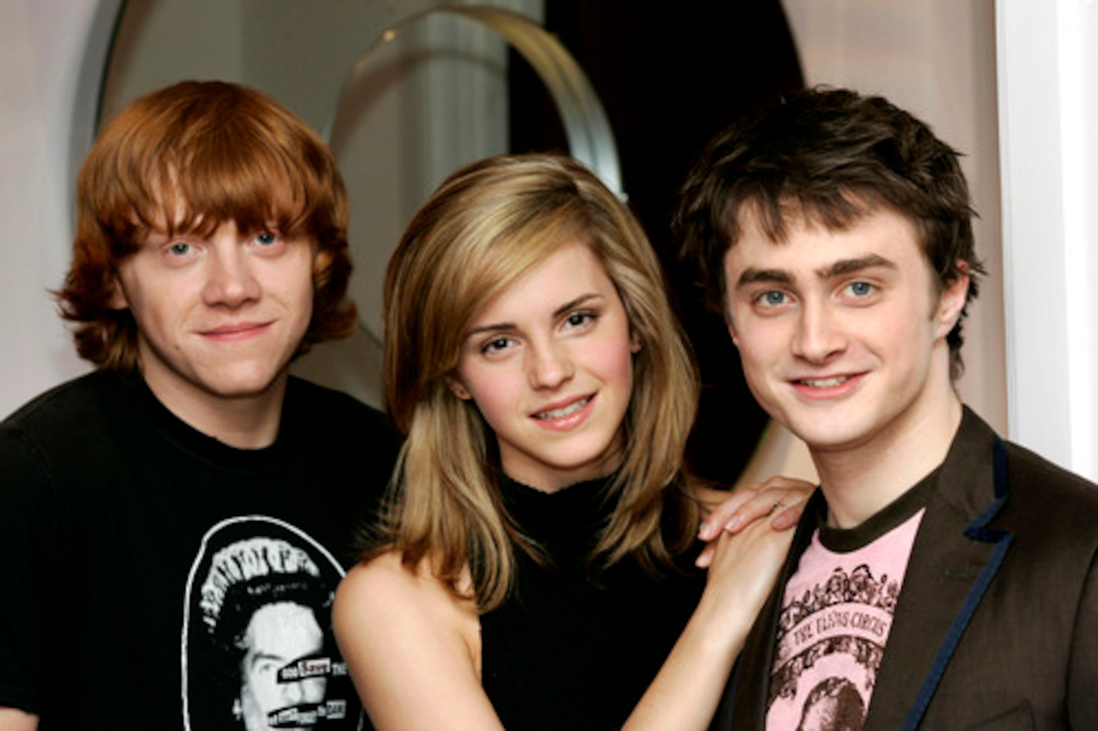 THE "HARRY POTTER" TRIO: Rupert Grint (left) and Emma Watson (center) earn about $4 million per "HP" film, and Daniel Radcliffe (right) will earn around $50 million for the final films, People says.